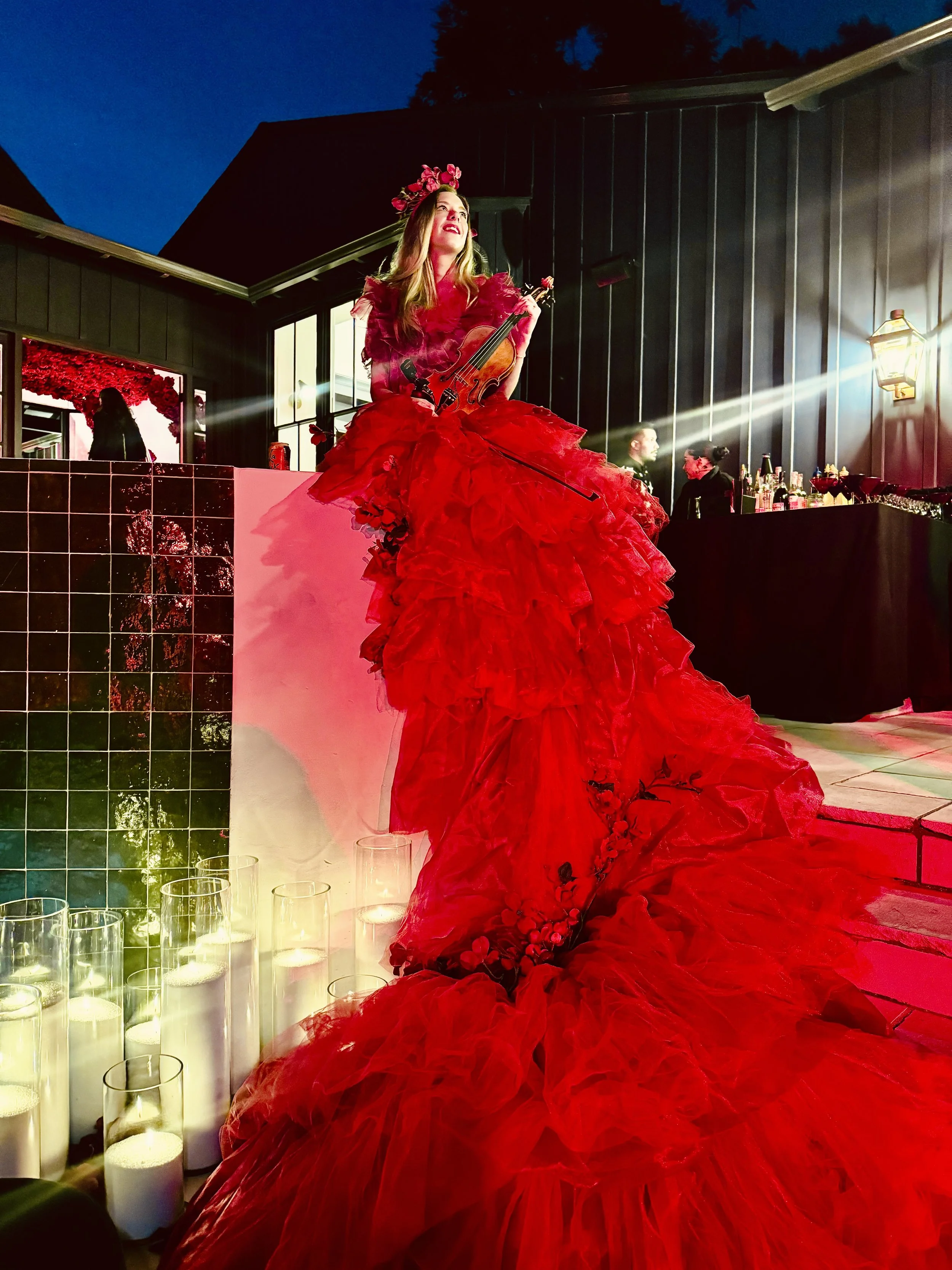 Elin Wolf performing live violin music at a luxury outdoor event in Southern California