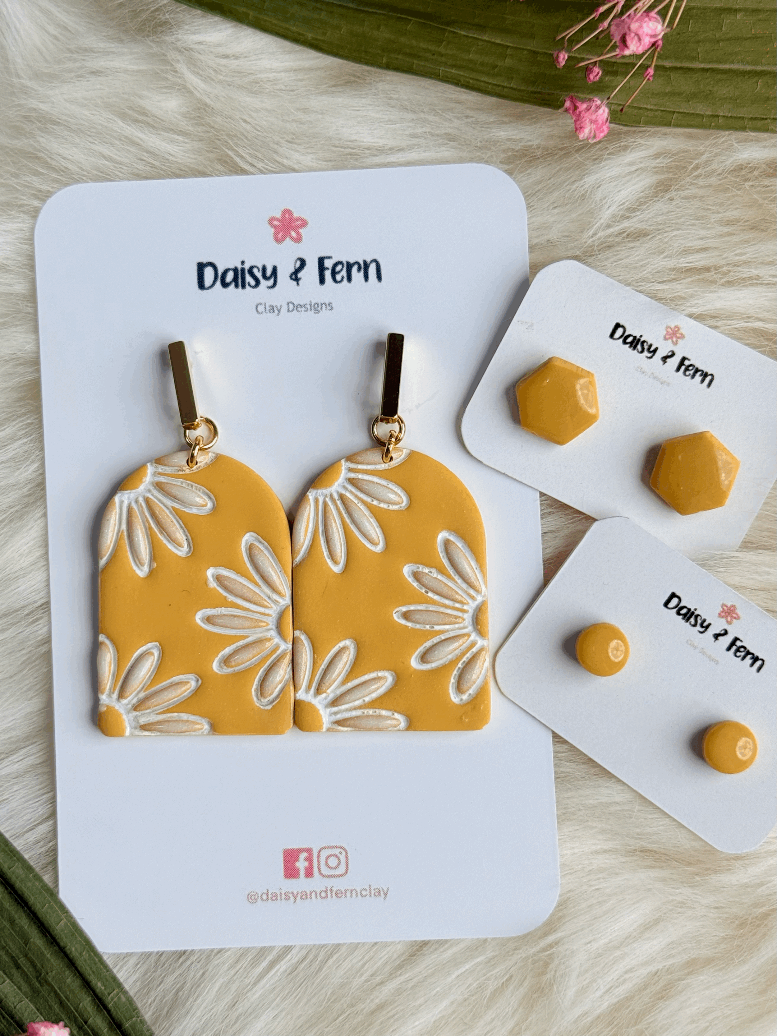 gold bar stainless steel earrings. sunflower yellow arch with d=white daisy outline and pearlescent daisy petals. Hexagon and Circle shape stud sets.
