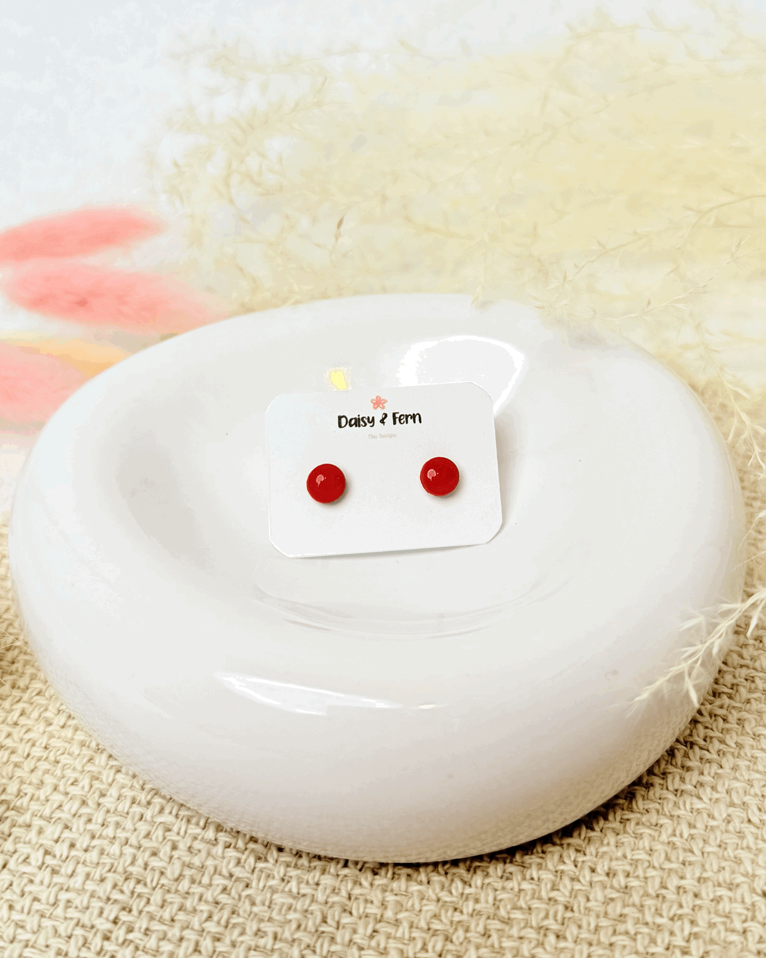 honeycomb orange circle studs stainless steel post and back on round jewellery trinket dish