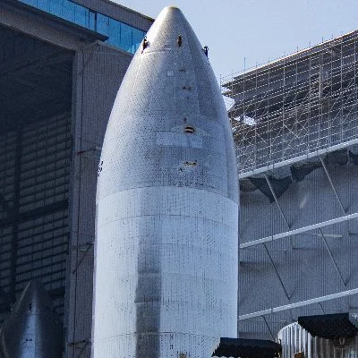 The Space Shuttle Atlantis's external fuel tank being prepared for display at the Kennedy Space Center.