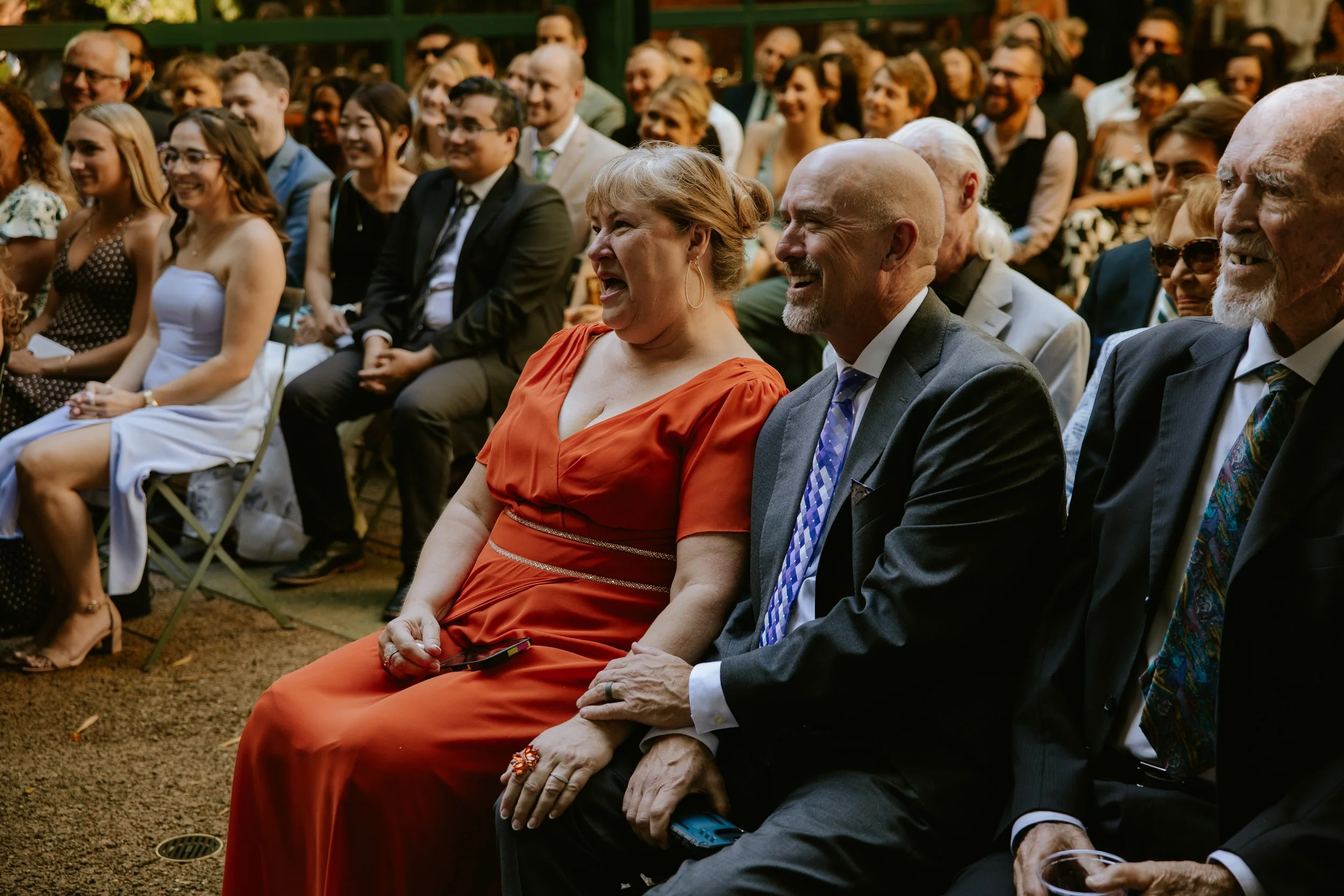Proud parents looking at the wedding couple during the wedding ceremony at Millwick in DTLA