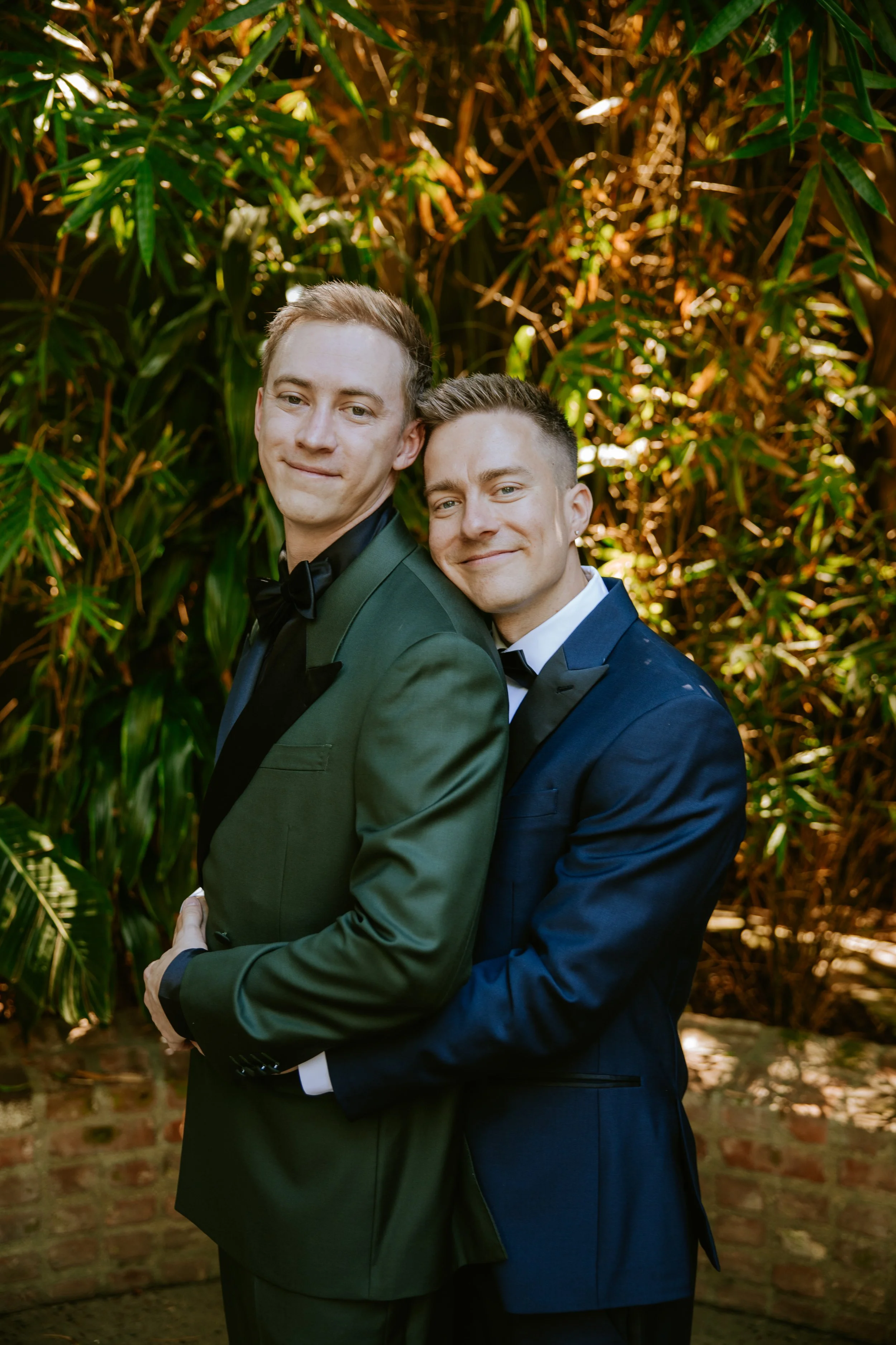 Grooms smiling at the camera  at Millwick by Marvimon in DTLA