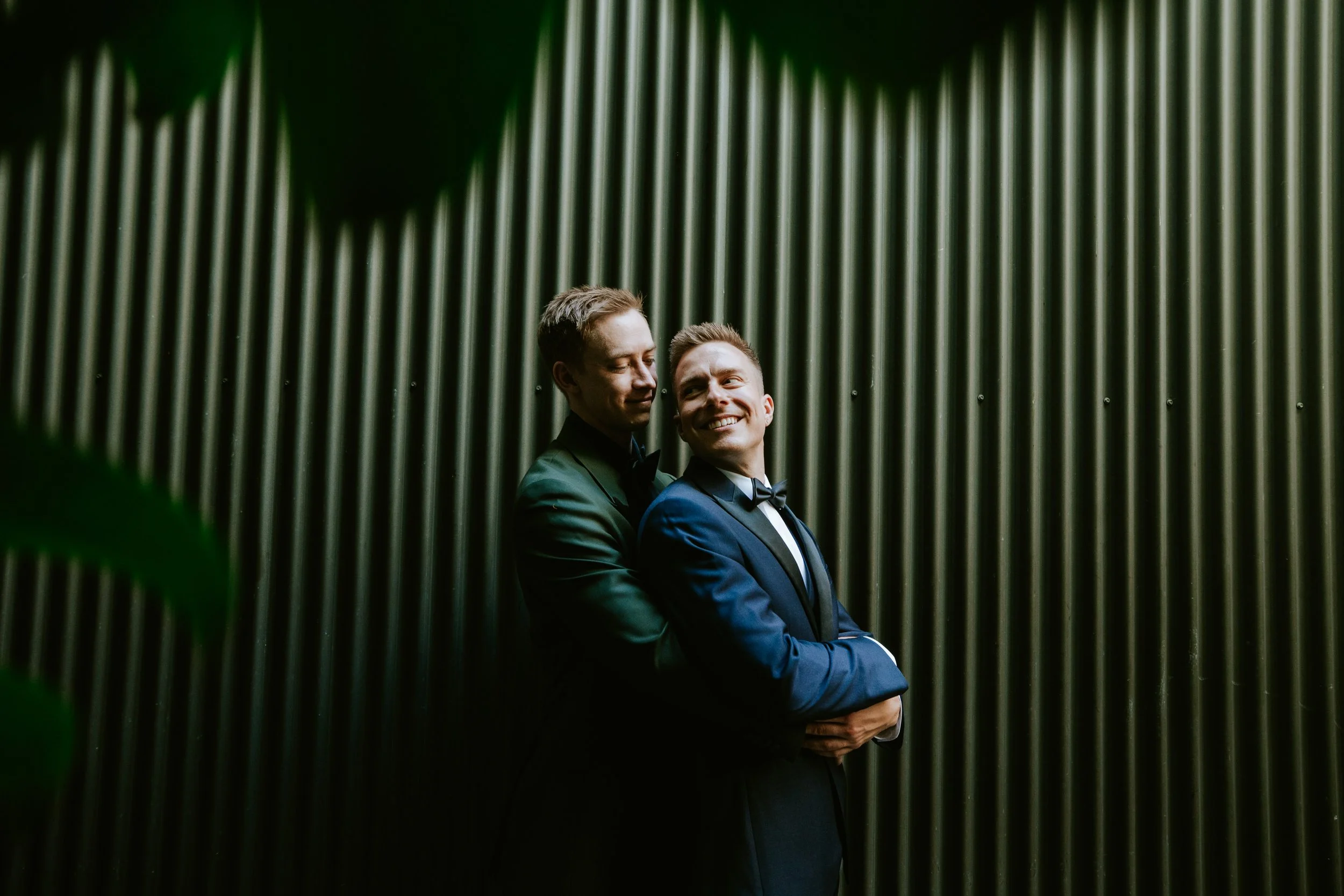 Grooms embracing at Millwick by Marvimon in DTLA