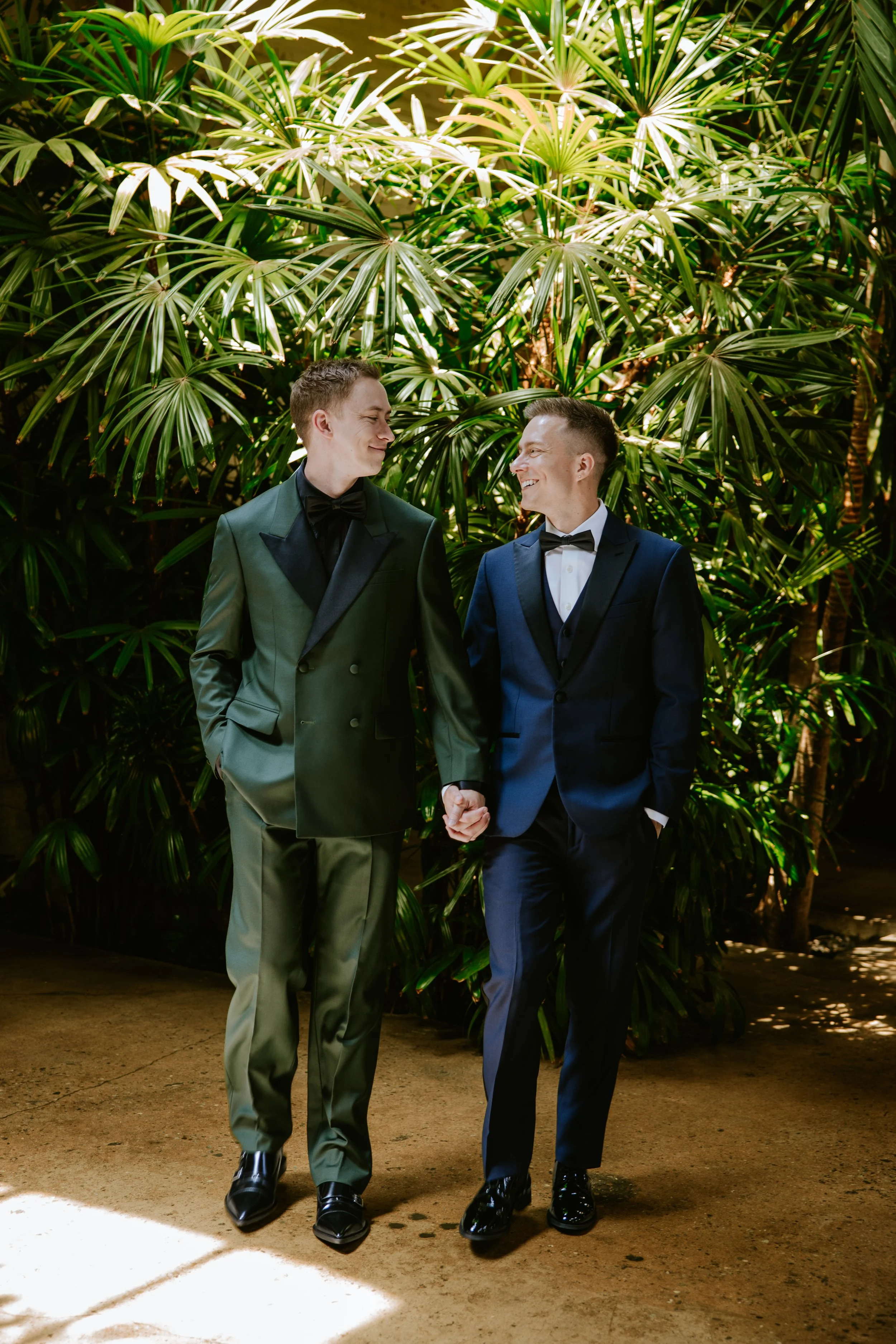 Grooms holding hands and walking at Millwick by Marvimon in DTLA 2