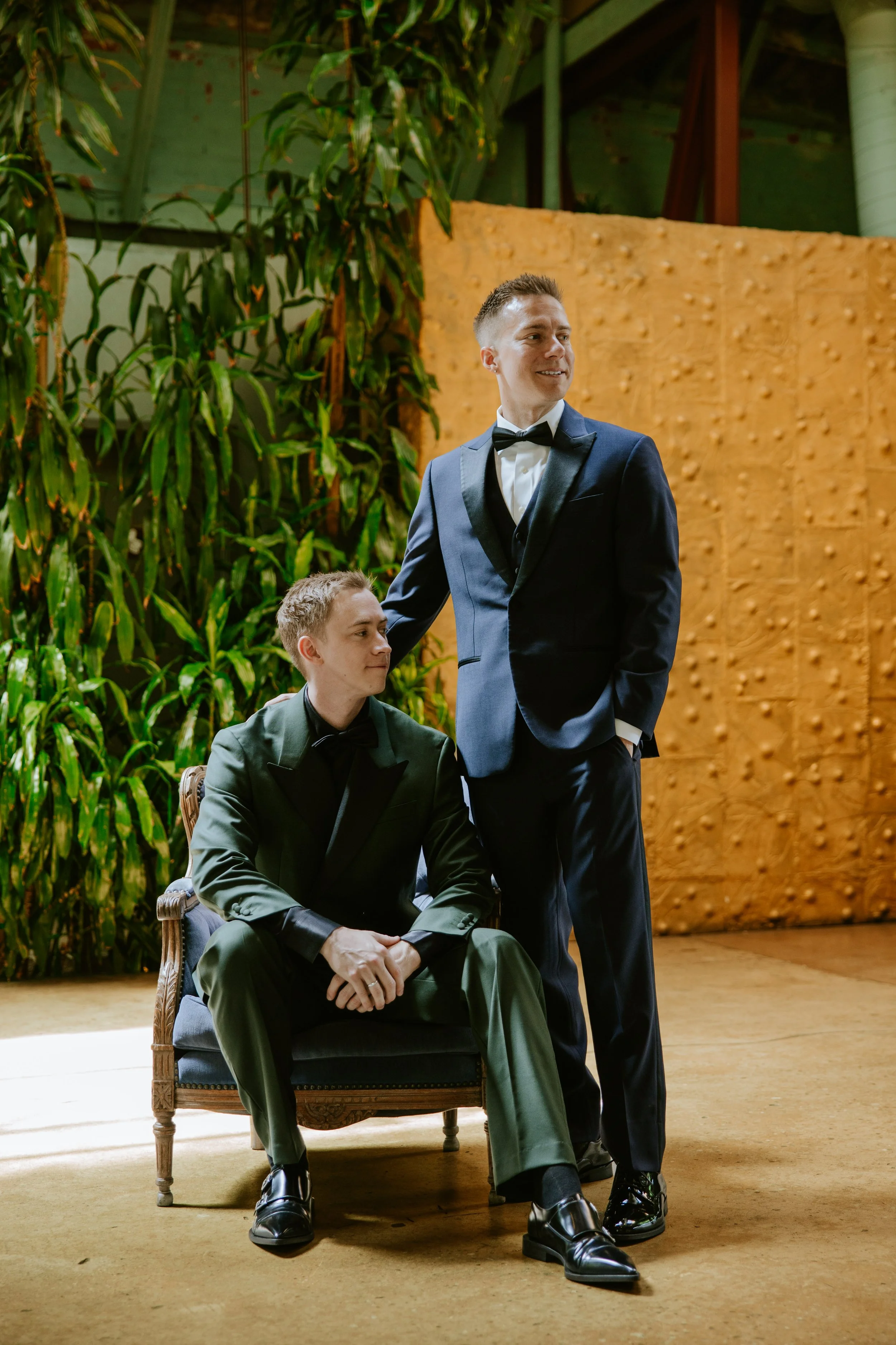 Sitting photo of grooms in front of a gold wall at Millwick by Marvimon in DTLA