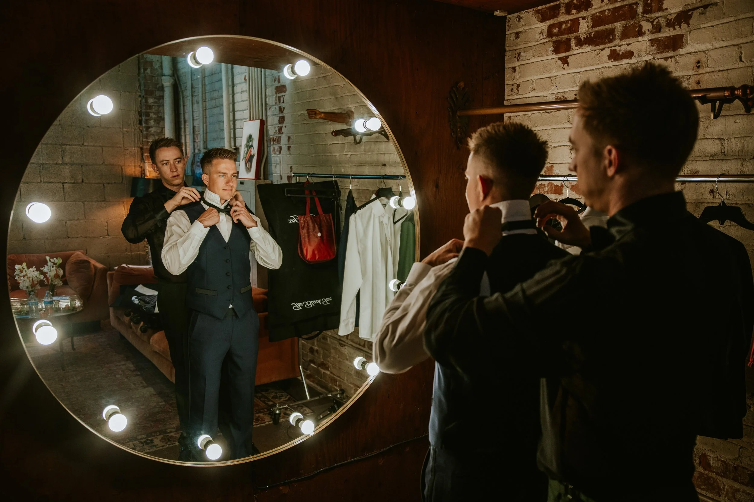 Groom adjusting tie at Millwick by Marvimon in DTLA