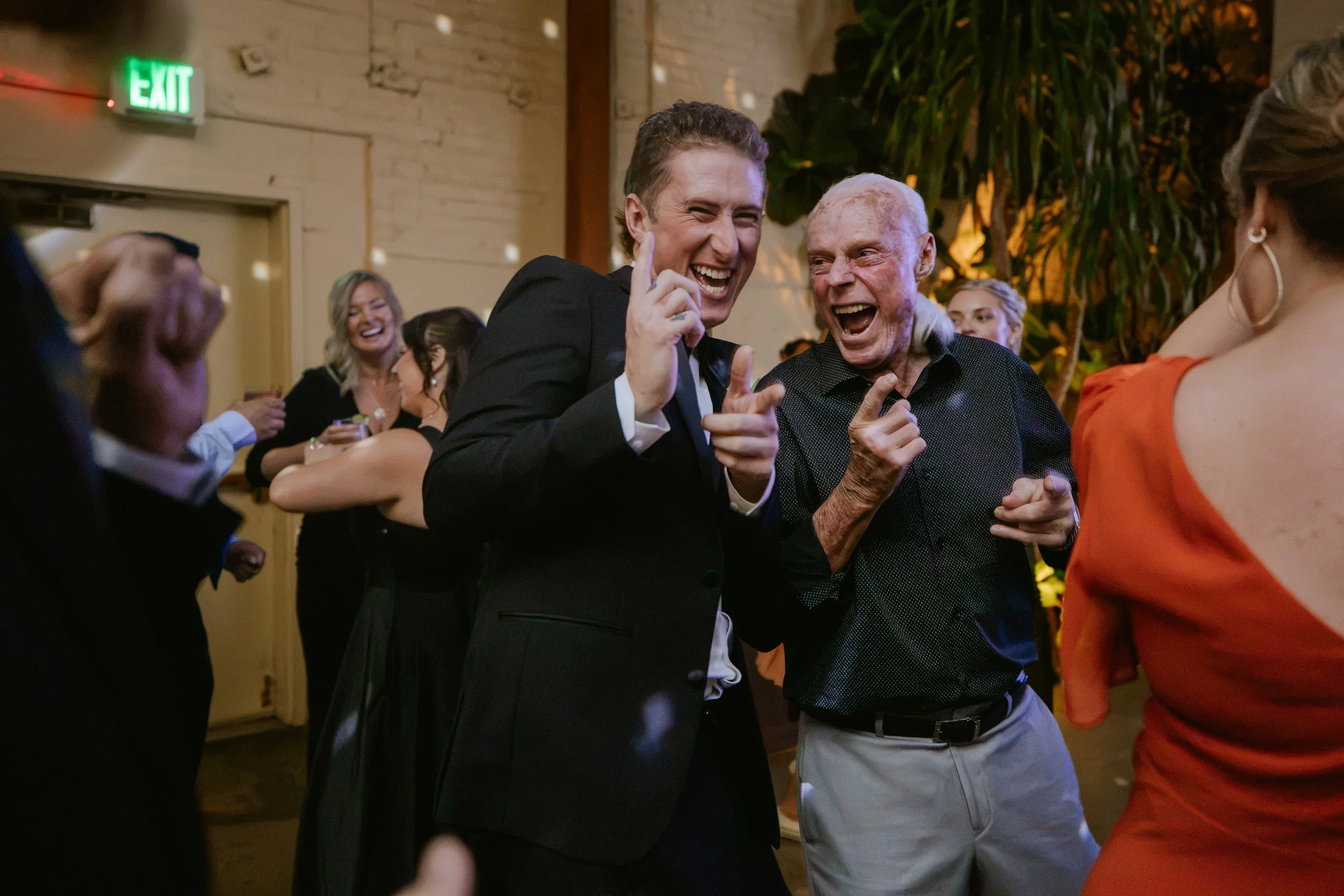 Grooms family dancing together