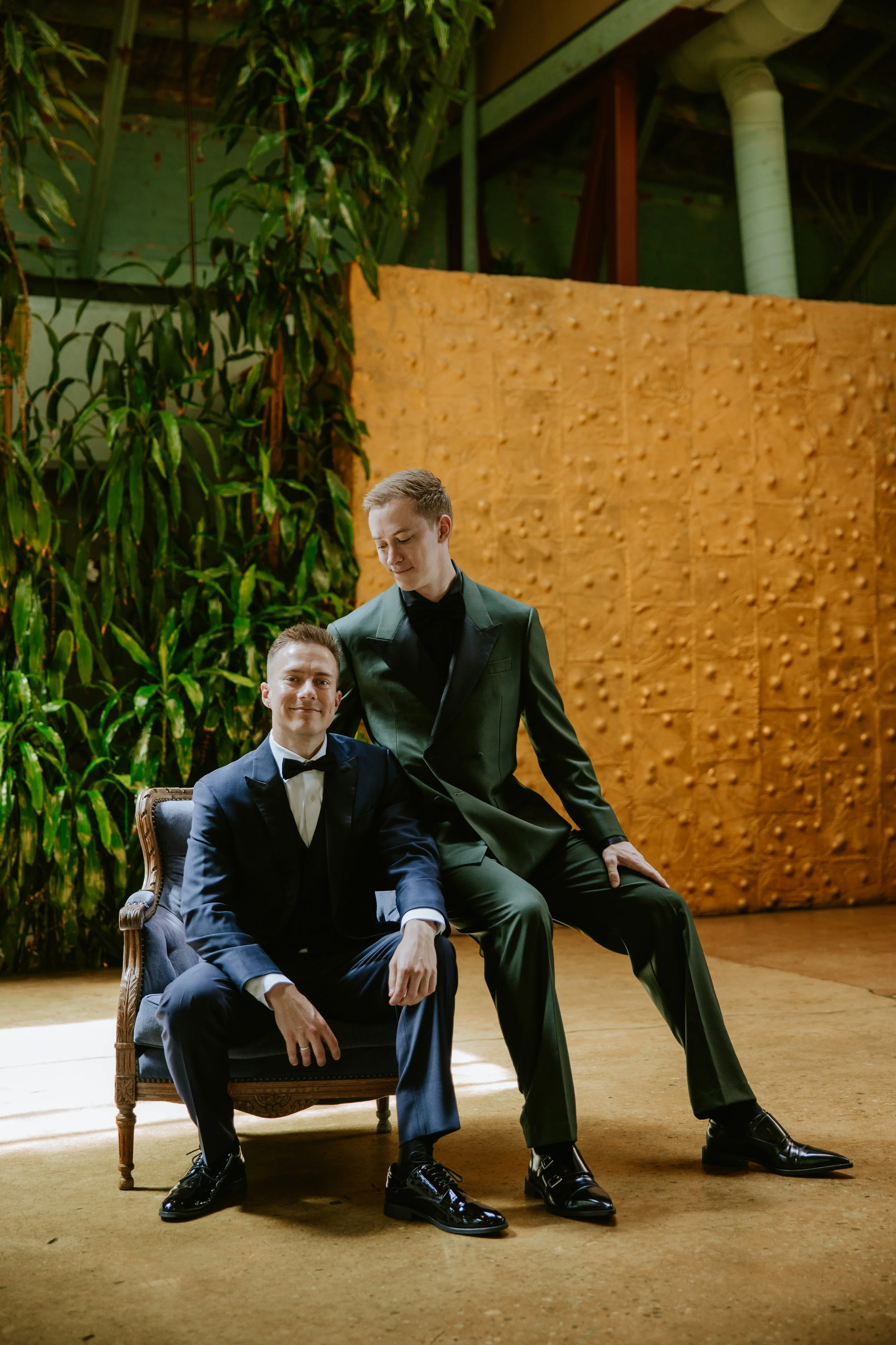 Sitting photo of grooms in front of a gold wall at Millwick by Marvimon in DTLA