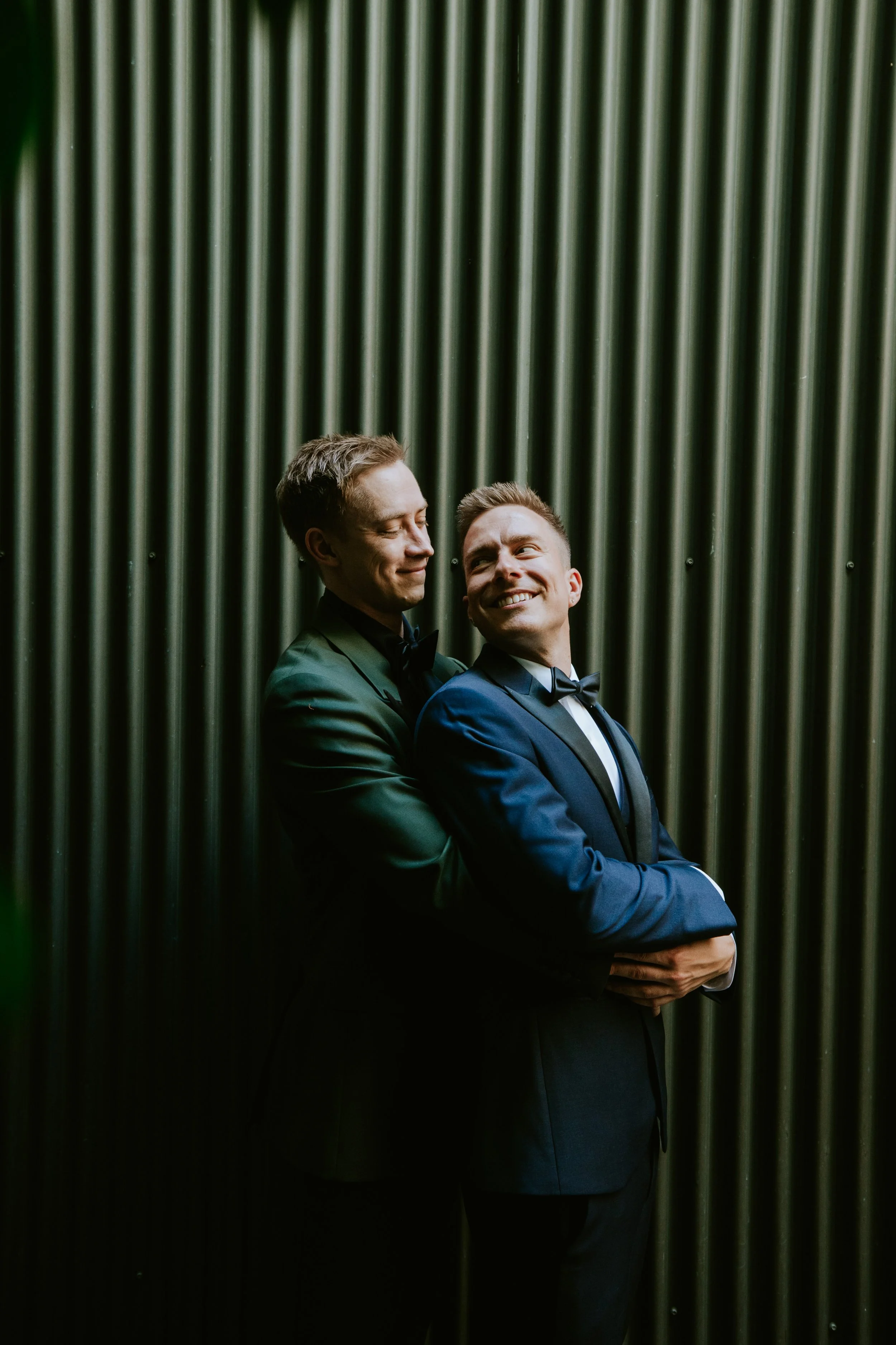 Grooms holding each other at Millwick by Marvimon in DTLA