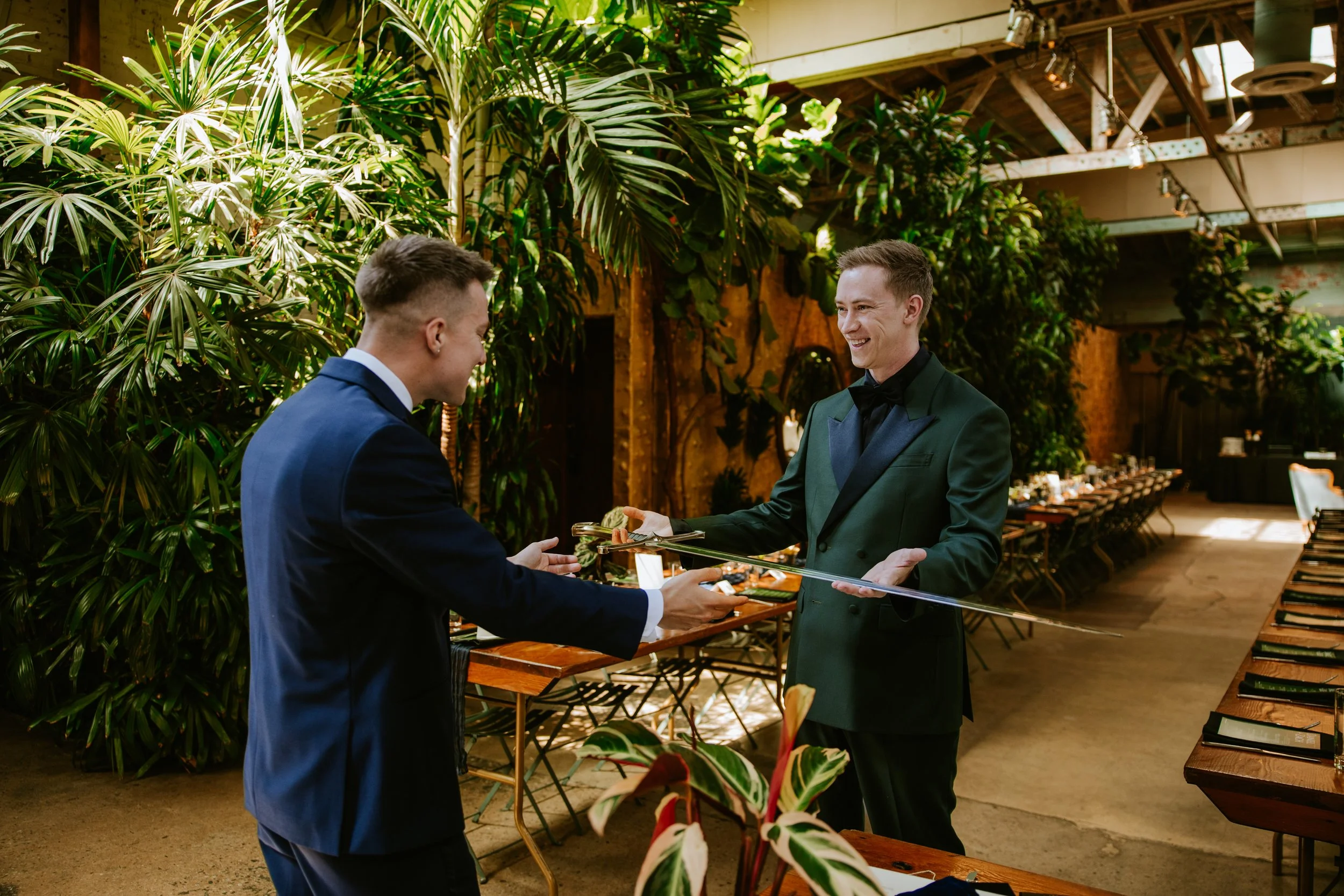 Groom accepting a sword as a surprise gift at Millwick by Marvimon in DTLA