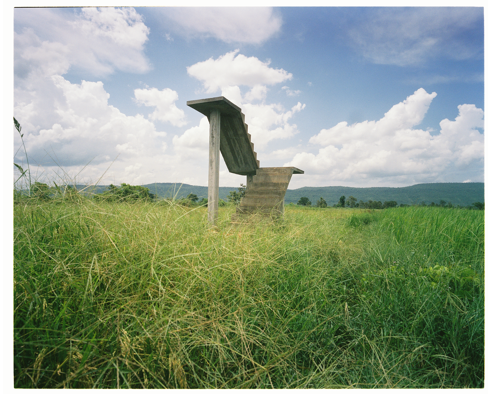 Kim Hak  
Stairs of Resident’s House in Phnom Thngai, Krokor District, Pursat Province, 2020 Photograph on Hahnemuhle Fine Art Baryta Satin 300gsm Paper 
70x87.3cm.  