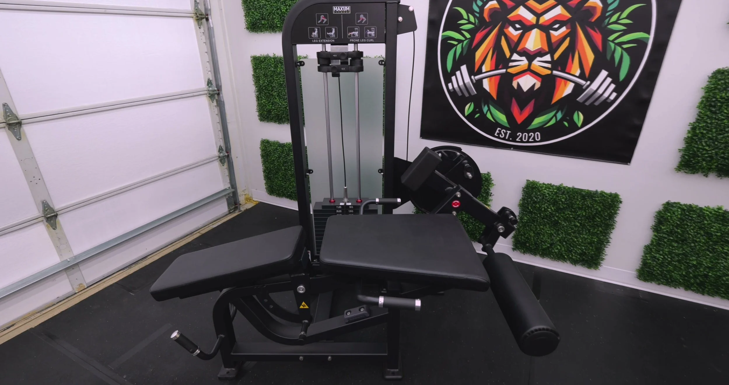 MAXUM LEC3 seated leg extension and lying leg curl machine in a home gym