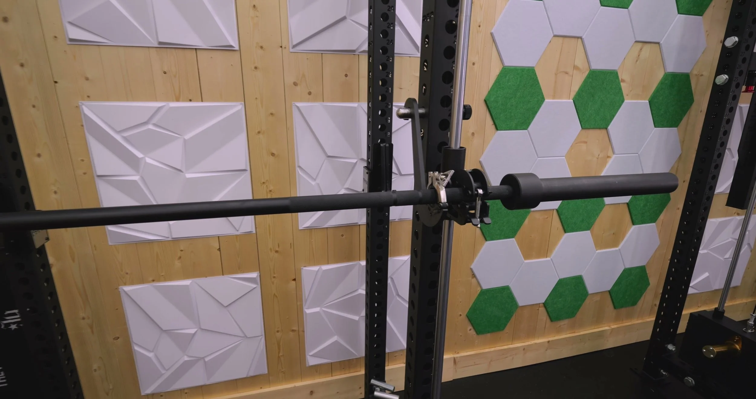 smith machine attachment clamp securing olympic barbell with wing nut
