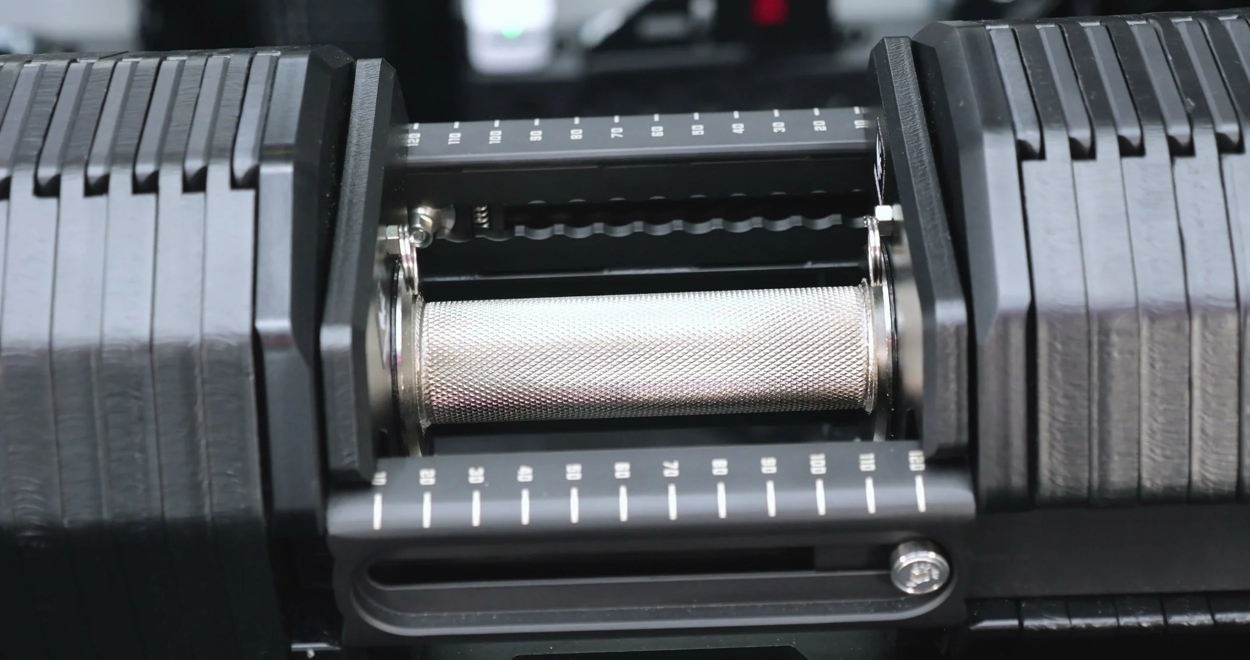 close-up of selector pin and numbered rail showing weight settings