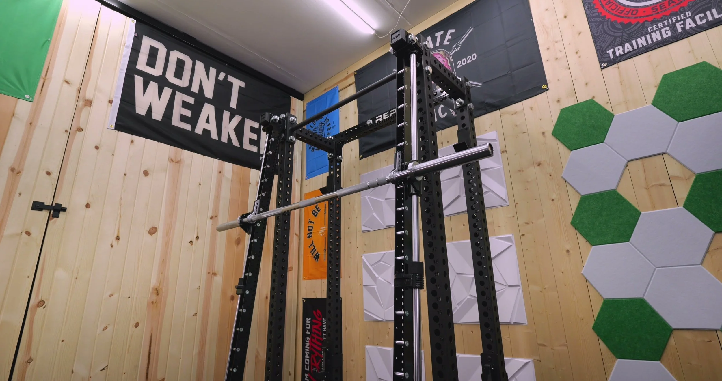side profile showing guide rods and smith machine path