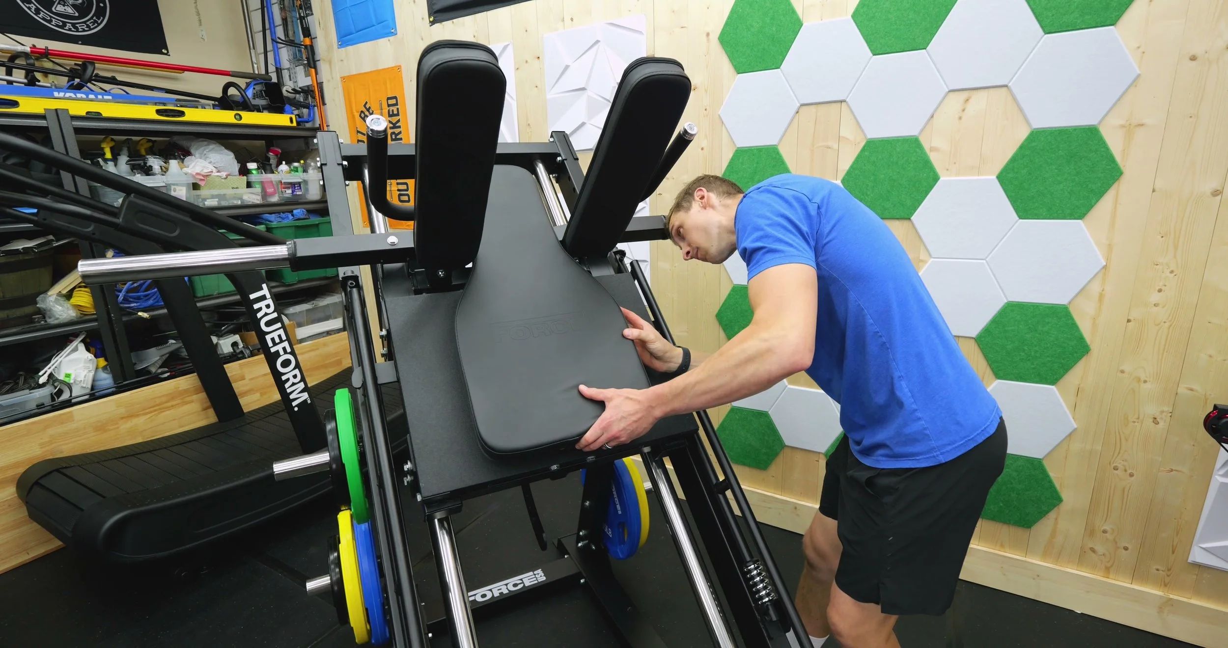 Force USA hack squat setup showing back pad and foot plate