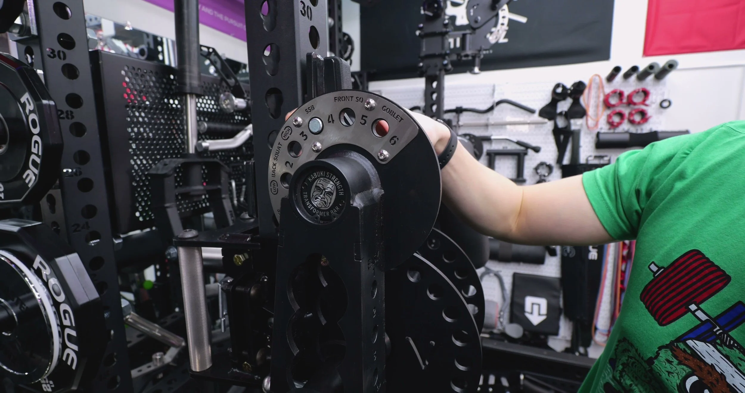 Squatting with the Kabuki Transformer Bar in a power rack showing upright torso position