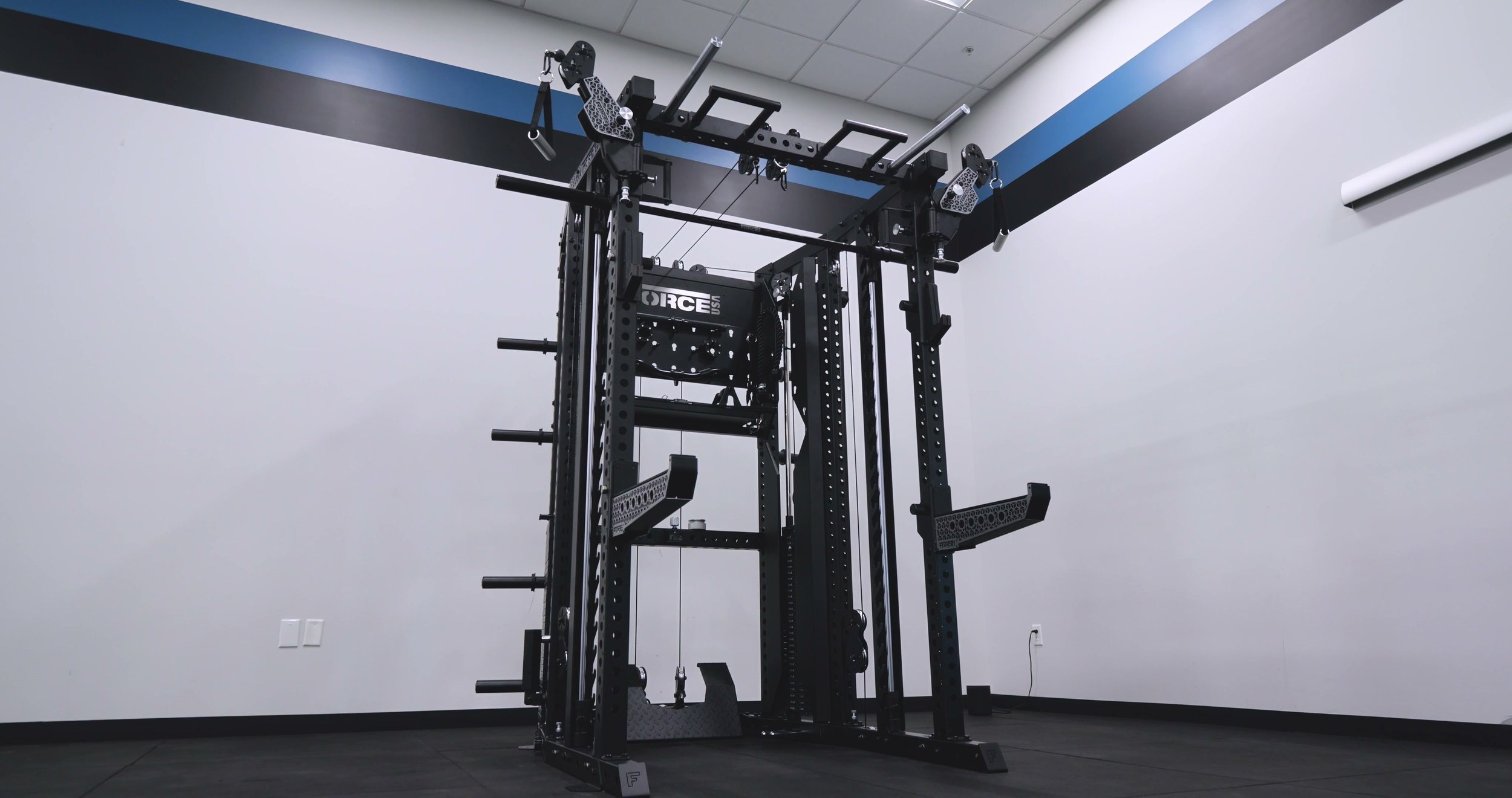 Force USA C20 all-in-one rack with articulating arms and integrated Smith machine