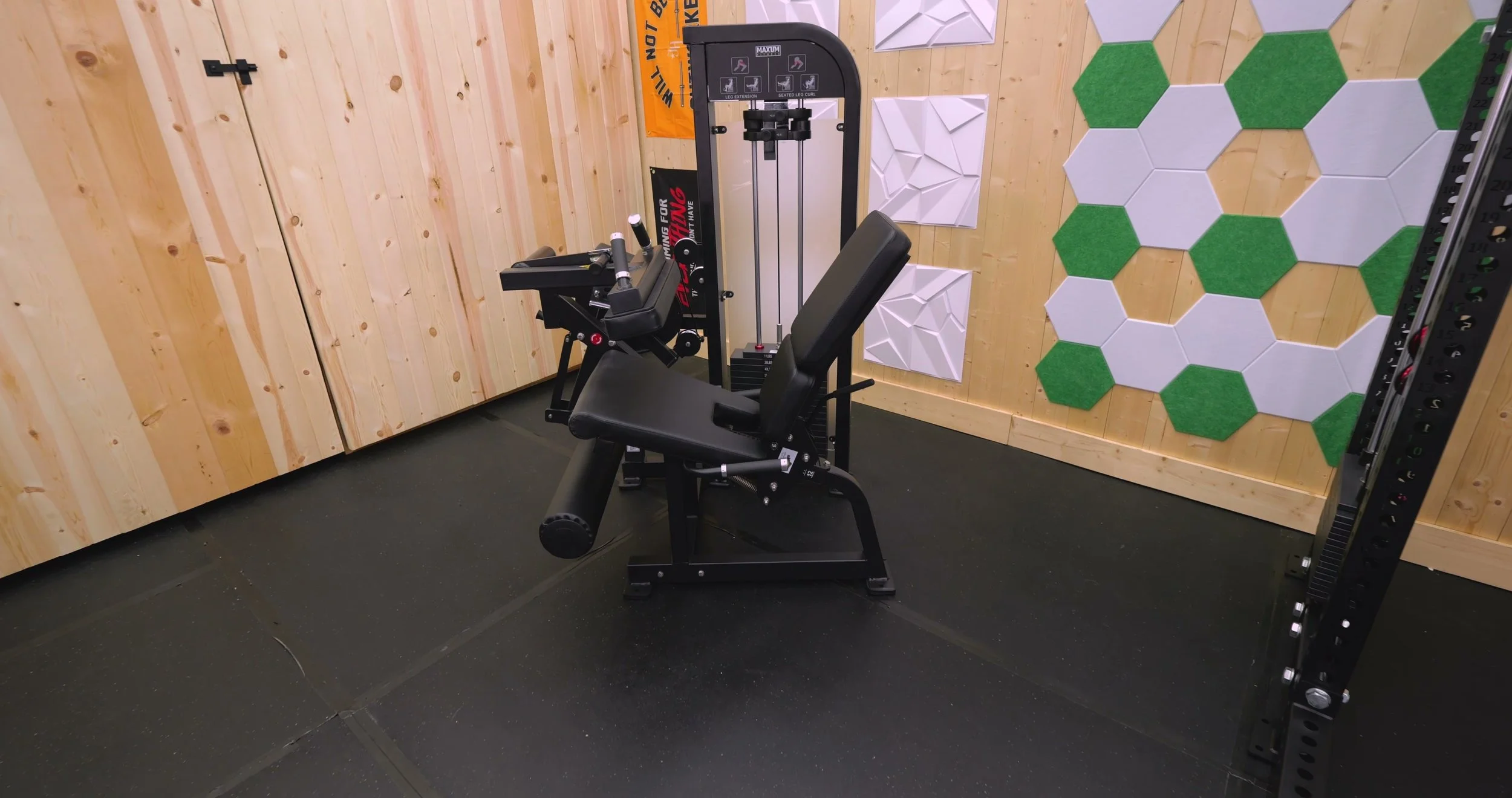 Maxum LEC2 leg extension and leg curl machine with selectorized weight stack