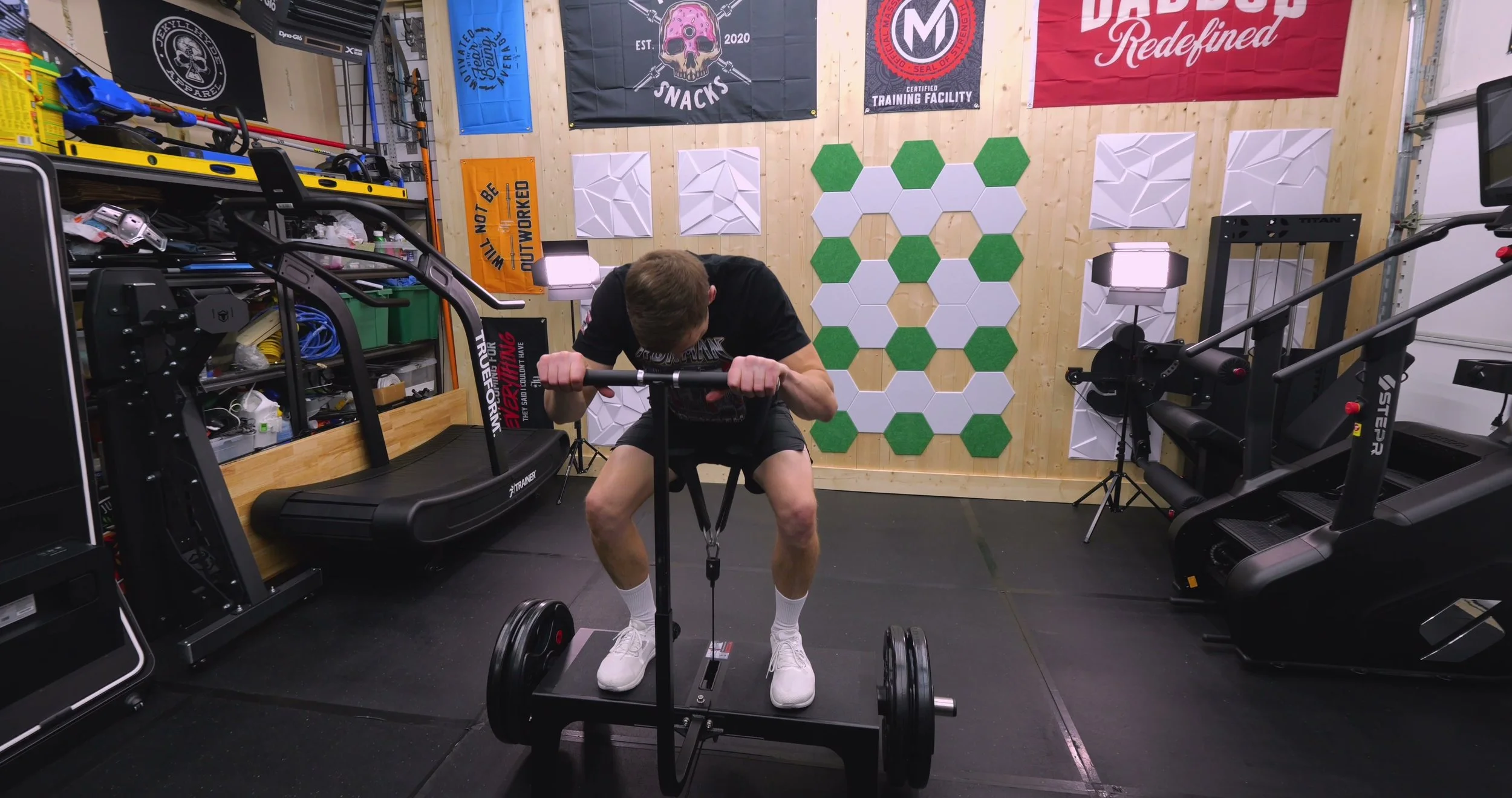Performing belt squats on the BodyKore Squat Box Pro