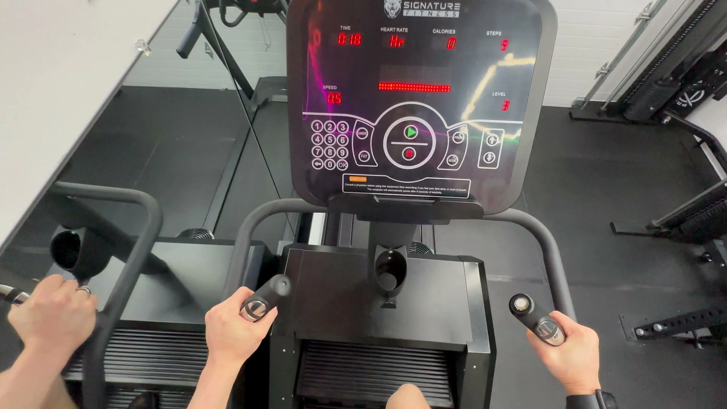 electronic stair climber console with speed and program buttons