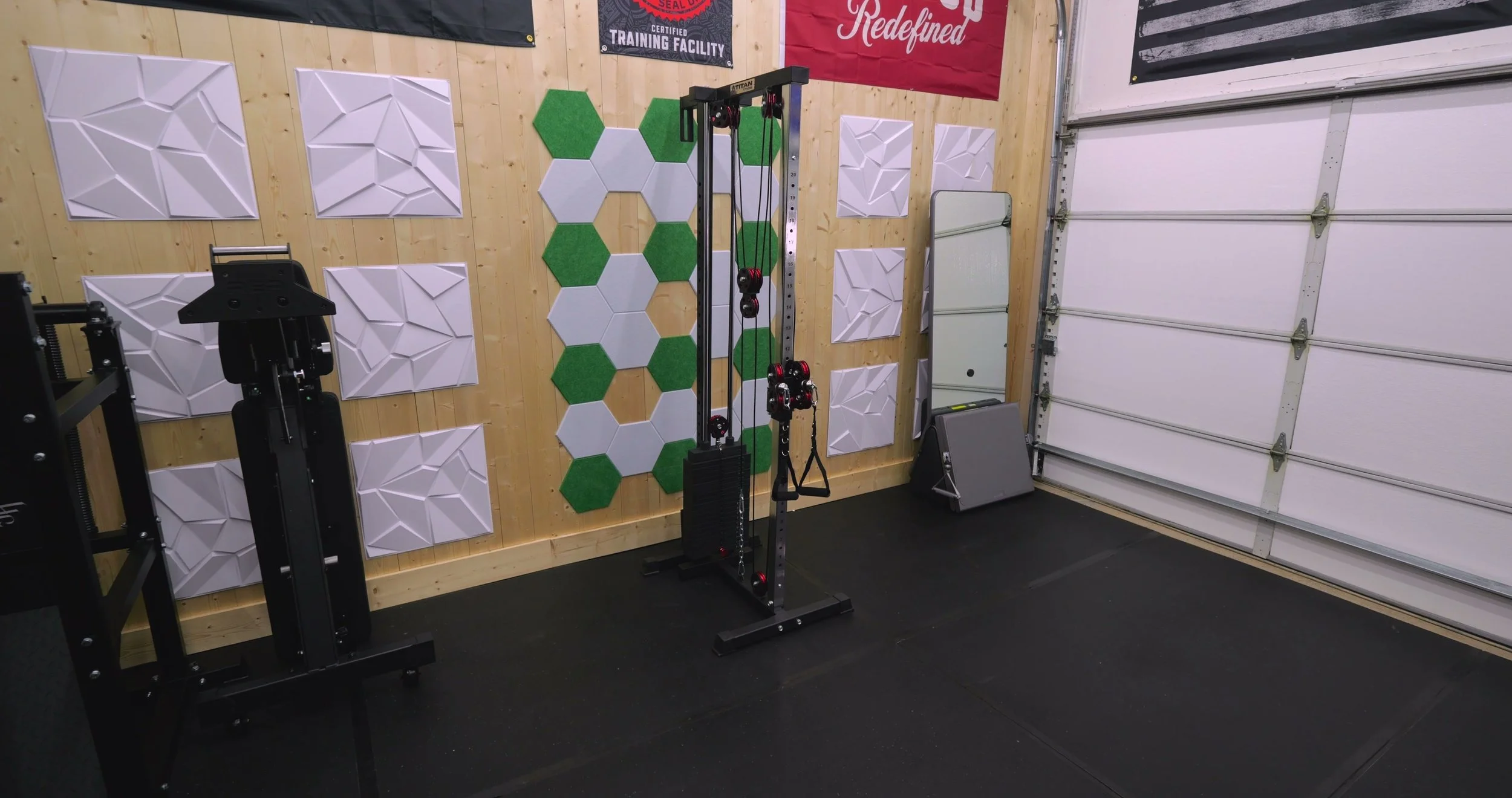 Titan Fitness selectorized wall and rack mounted cable pulley tower in a home gym