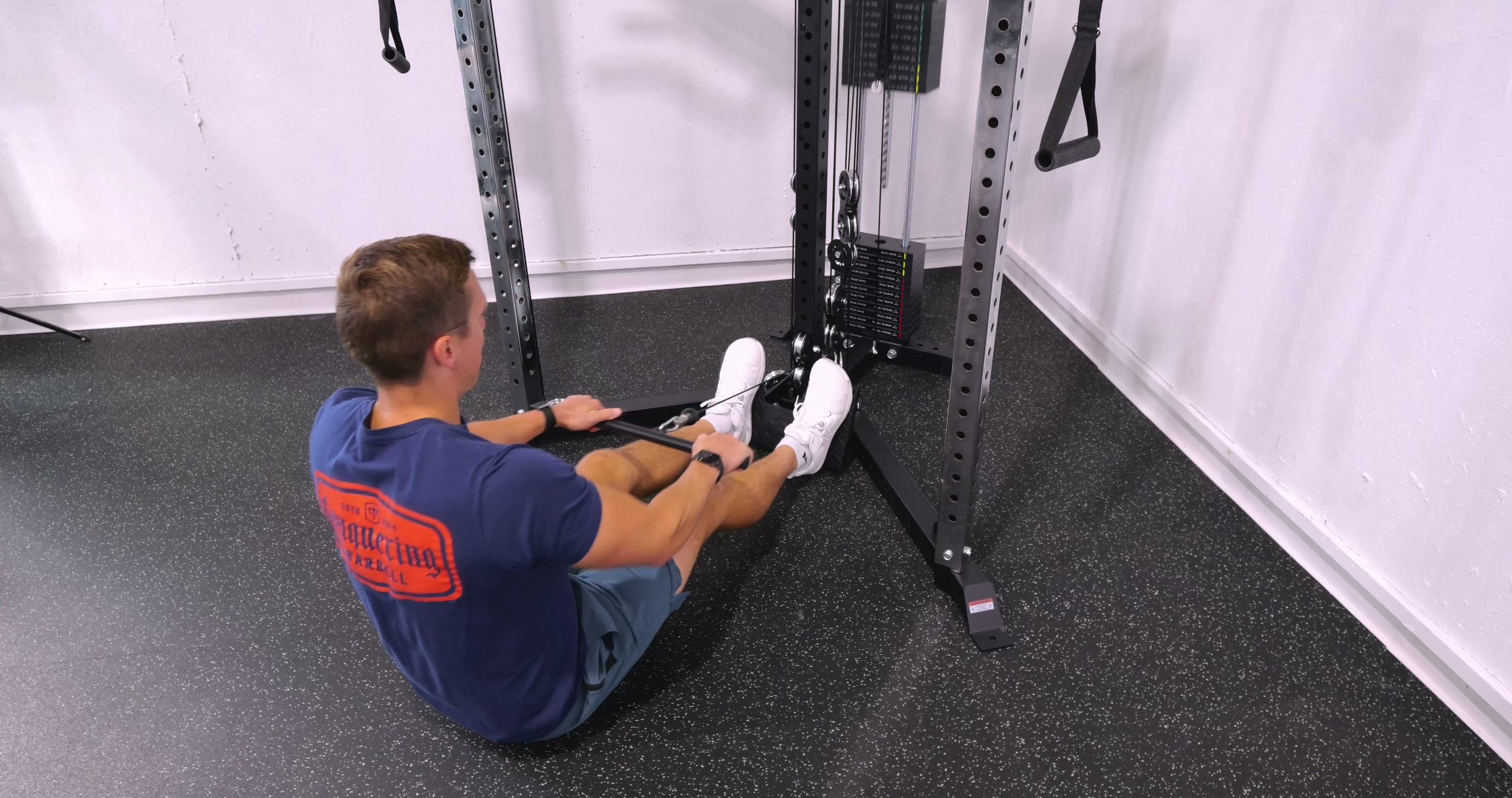 Center lat pulldown and low-row station with adjustable footplate on the Bells of Steel All-in-One Trainer