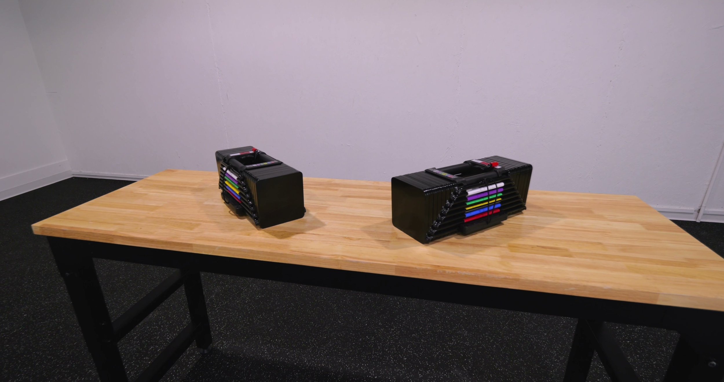PowerBlock Elite USA 90 adjustable dumbbells in a home gym