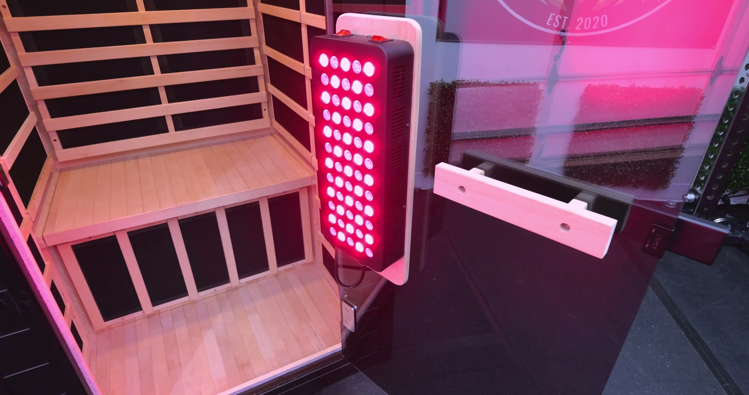 Interior view of infrared panels and red light therapy section inside sauna