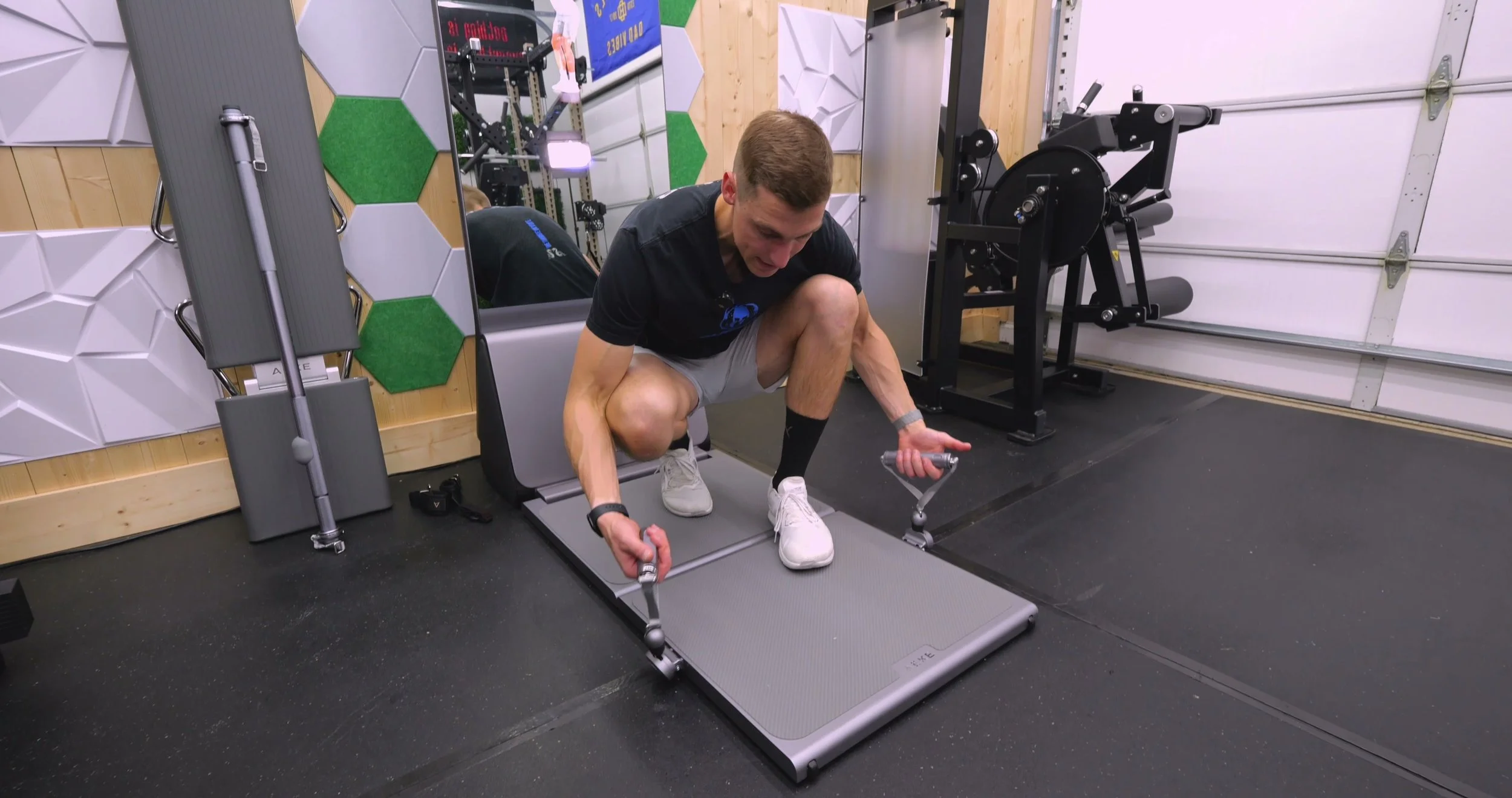 AEKE Home Gym ground-level cable exits with handles attached