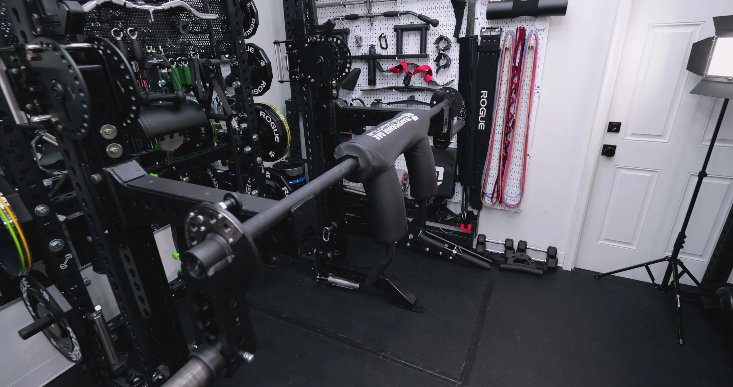 Rogue Kabuki Transformer Bar on a power rack in a home gym