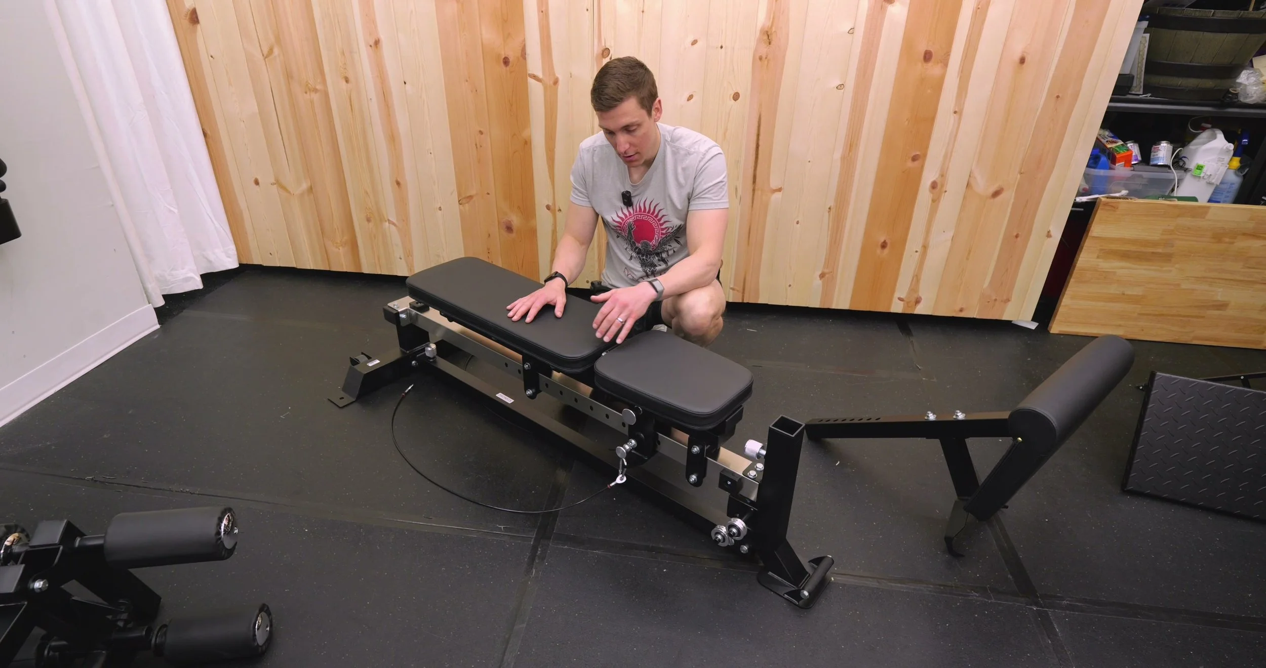 Demonstrating the lateral wobble of the Force USA Sliding Bench when locked in a stationary position