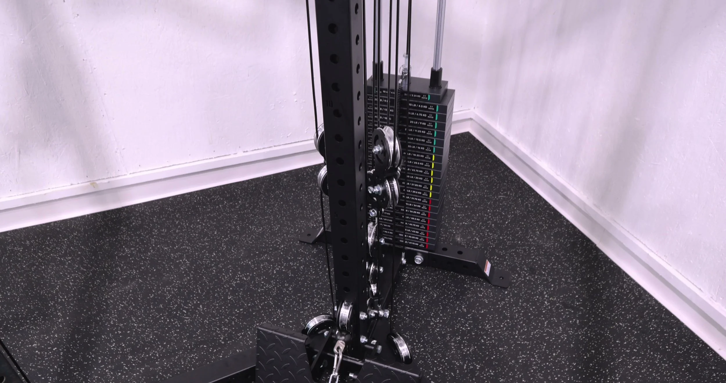 Bells of Steel All-in-One Trainer positioned in a home gym corner to show its compact footprint
