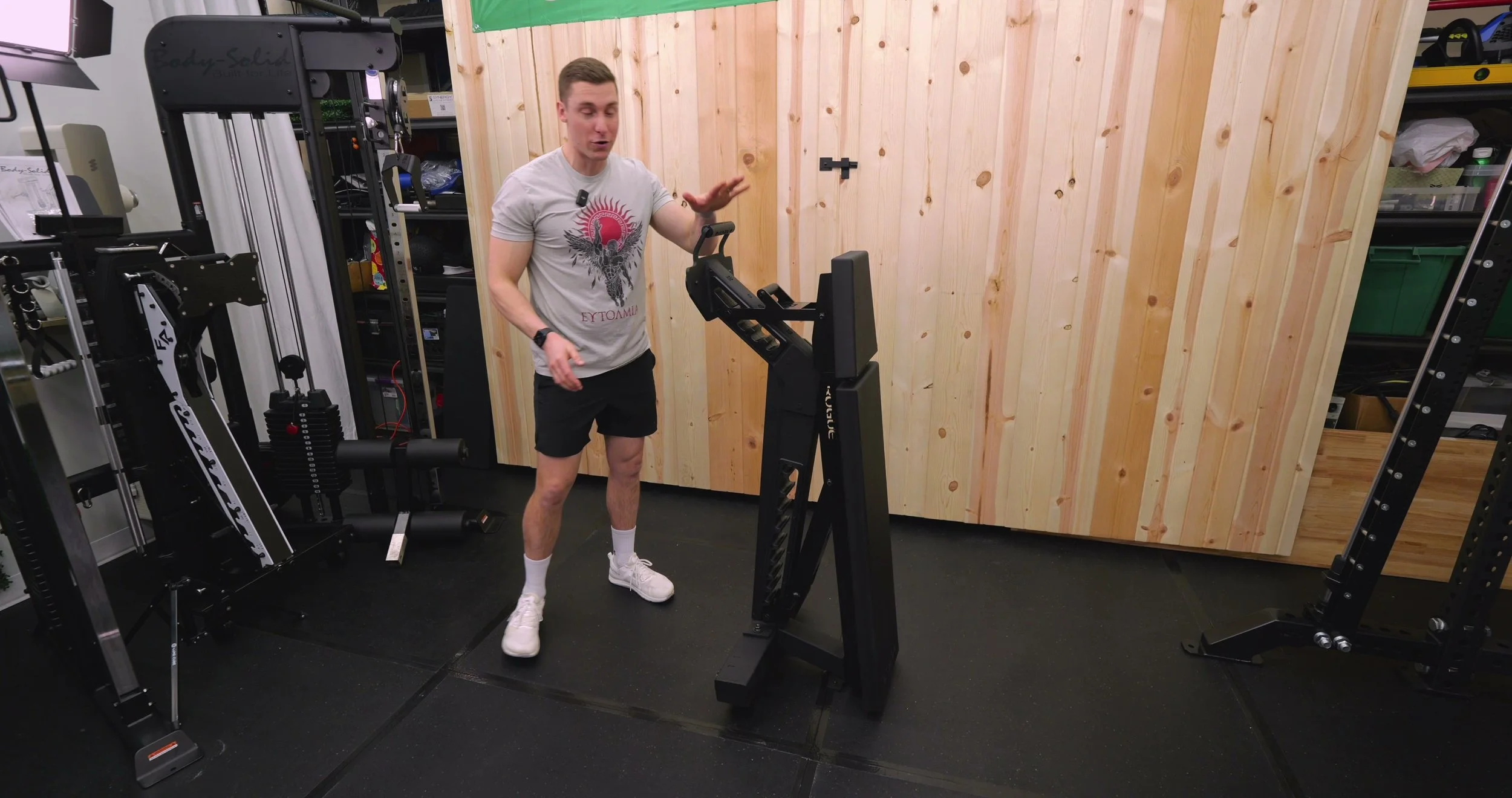 rogue manta ray bench stored upright in home gym corner