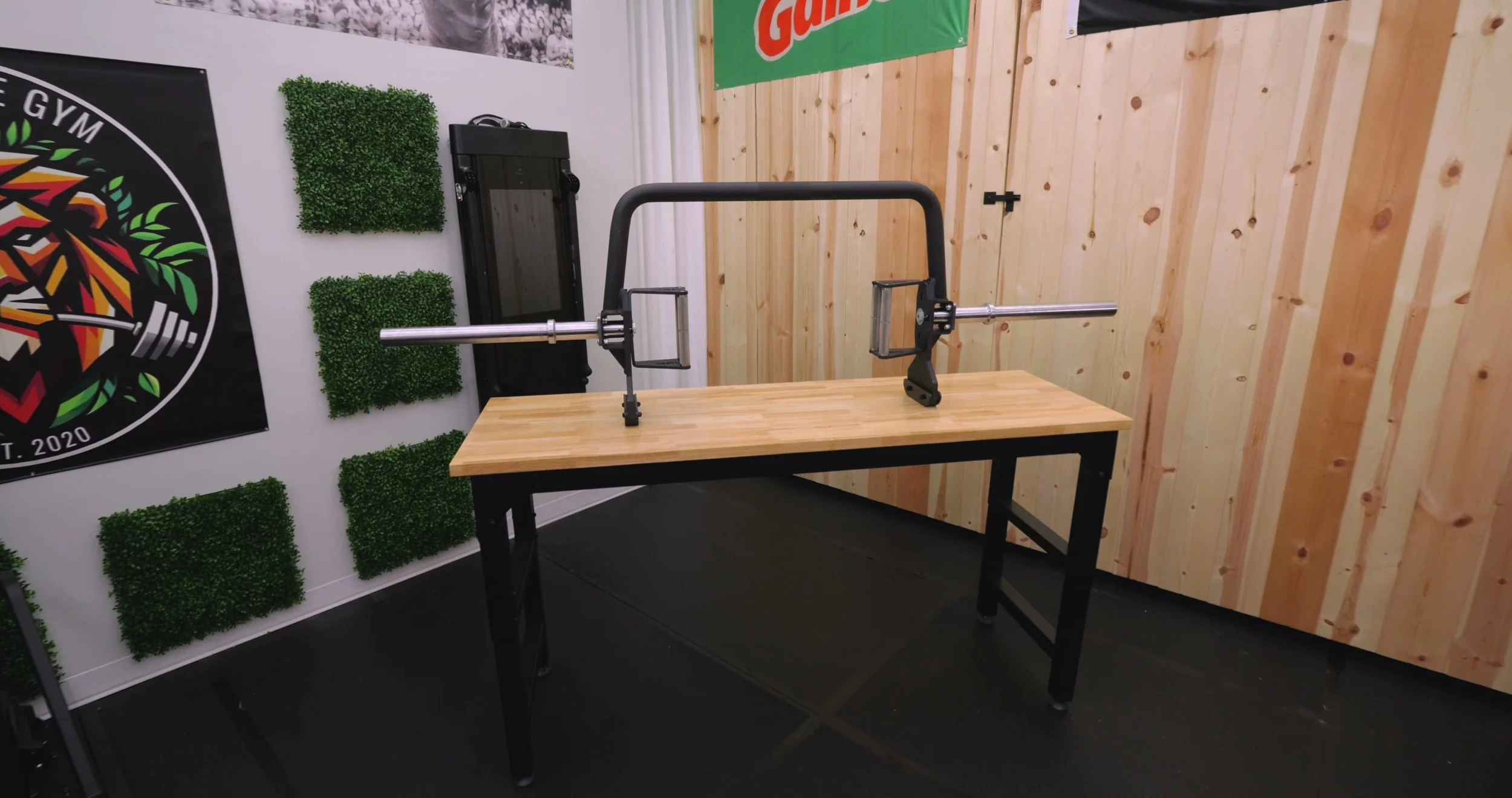 REP Fitness Open Trap Bar resting on its built-in kickstand in a home gym