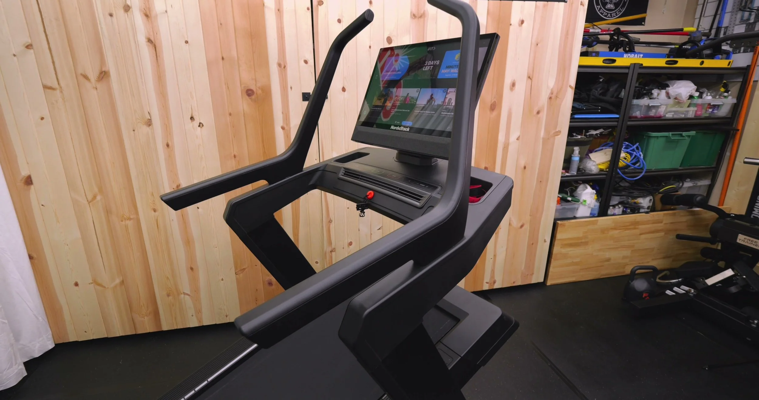 NordicTrack X24 treadmill set to a steep incline in a home gym