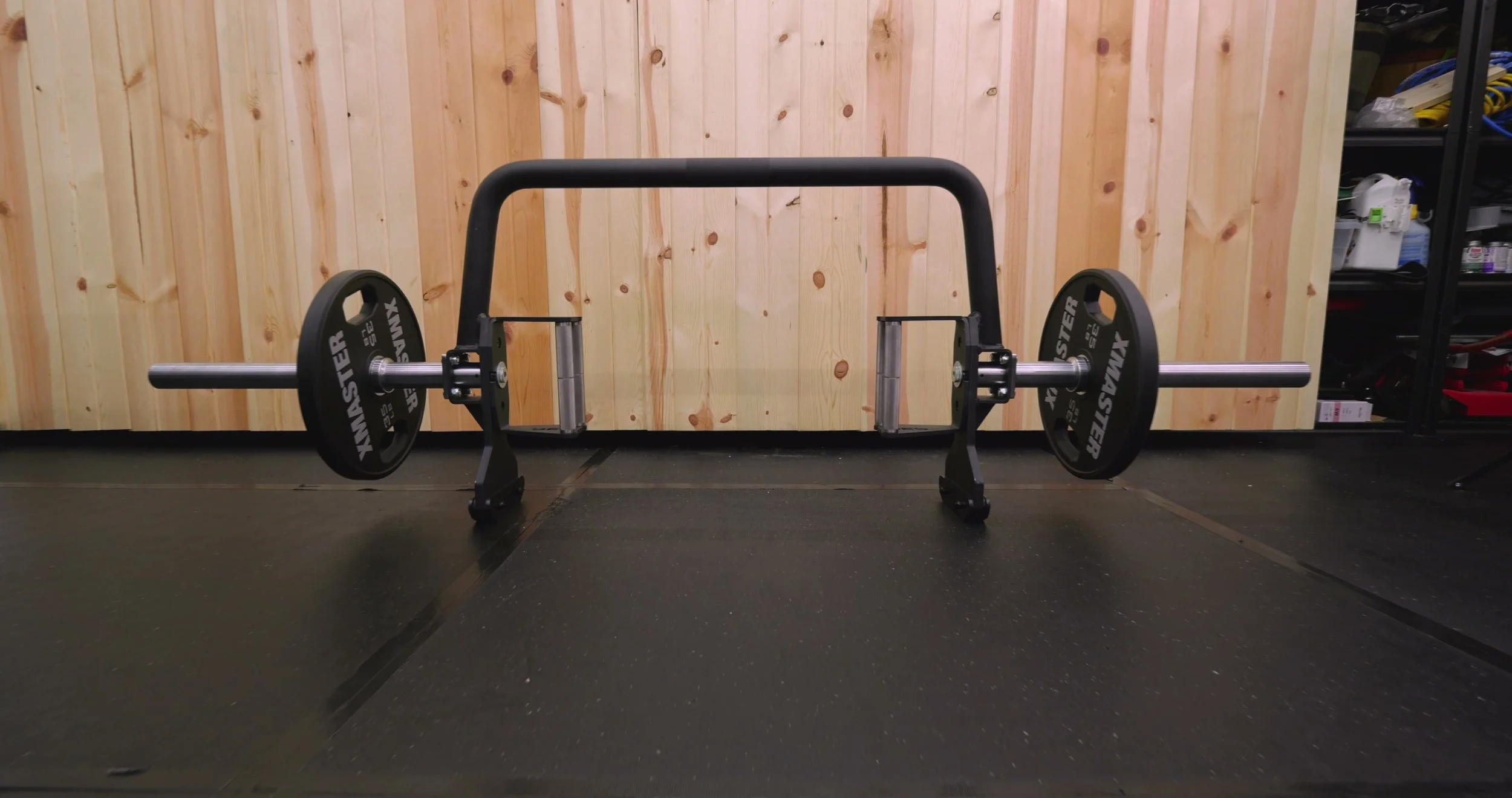 The UHMW-lined kickstand holding the REP Open Trap Bar vertically for easy plate loading