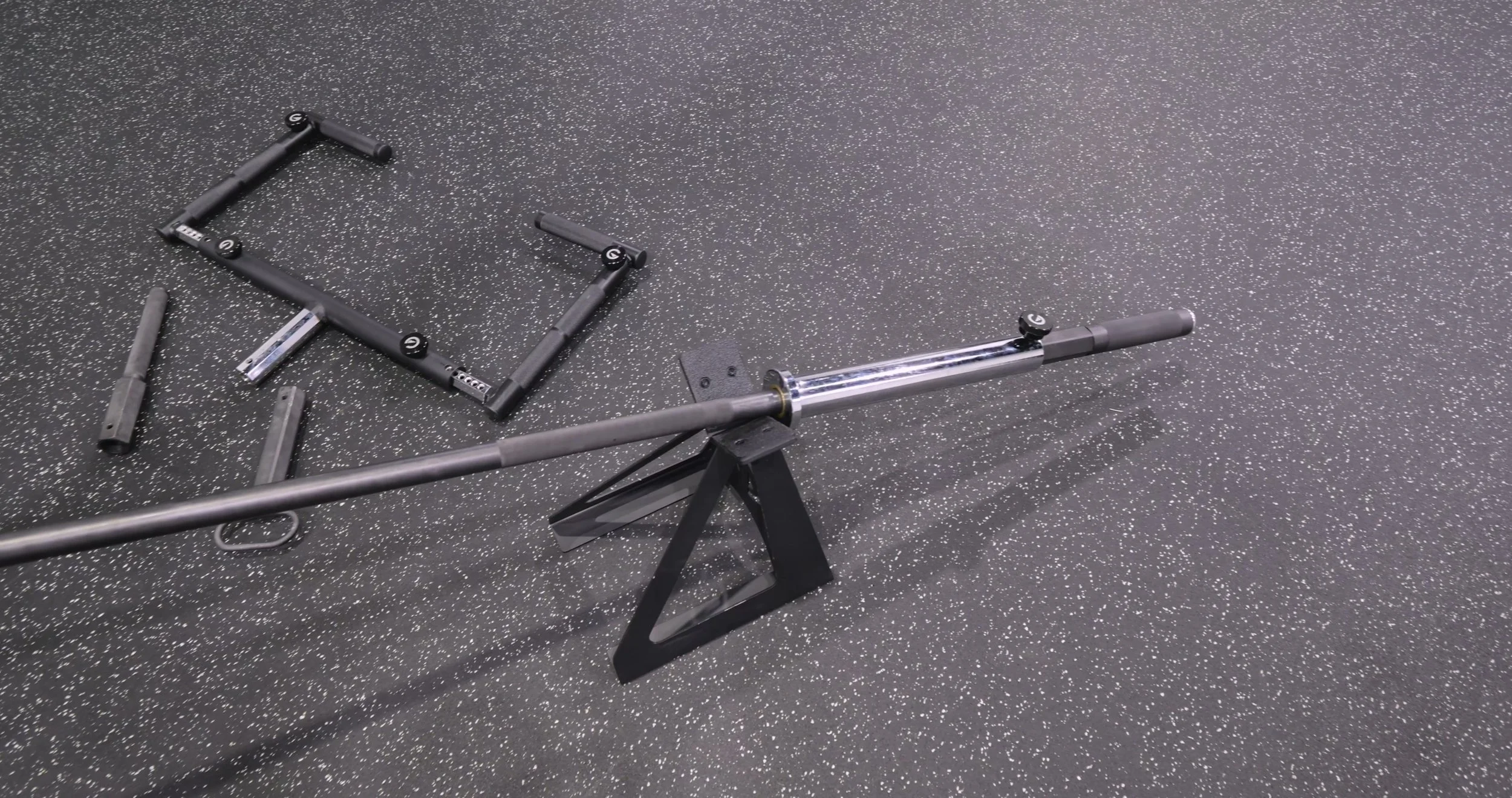 Exponent Edge Landmine Bar mounted to a power rack with Olympic plates loaded