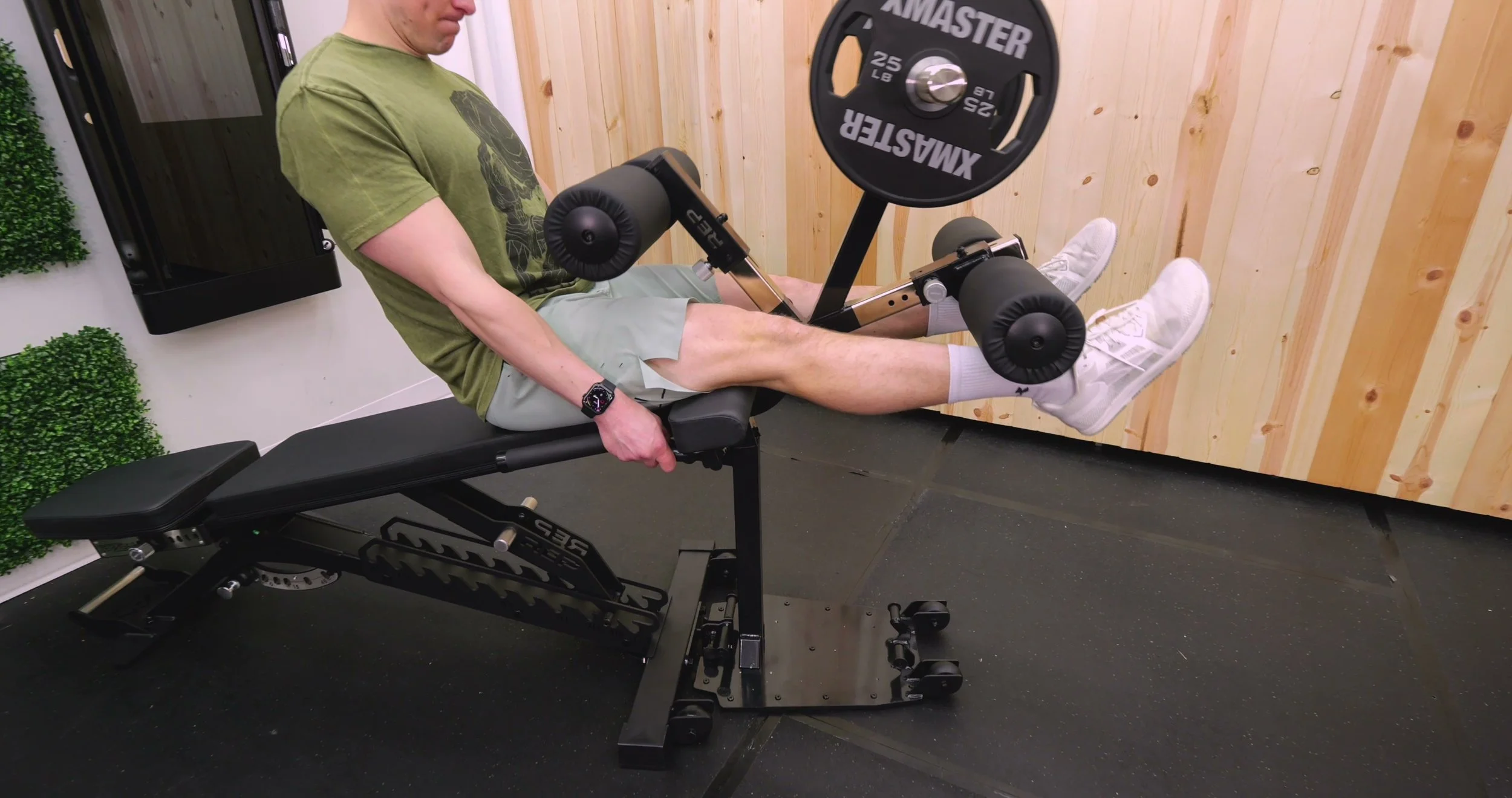 rep bench attachment being used for seated leg extensions
