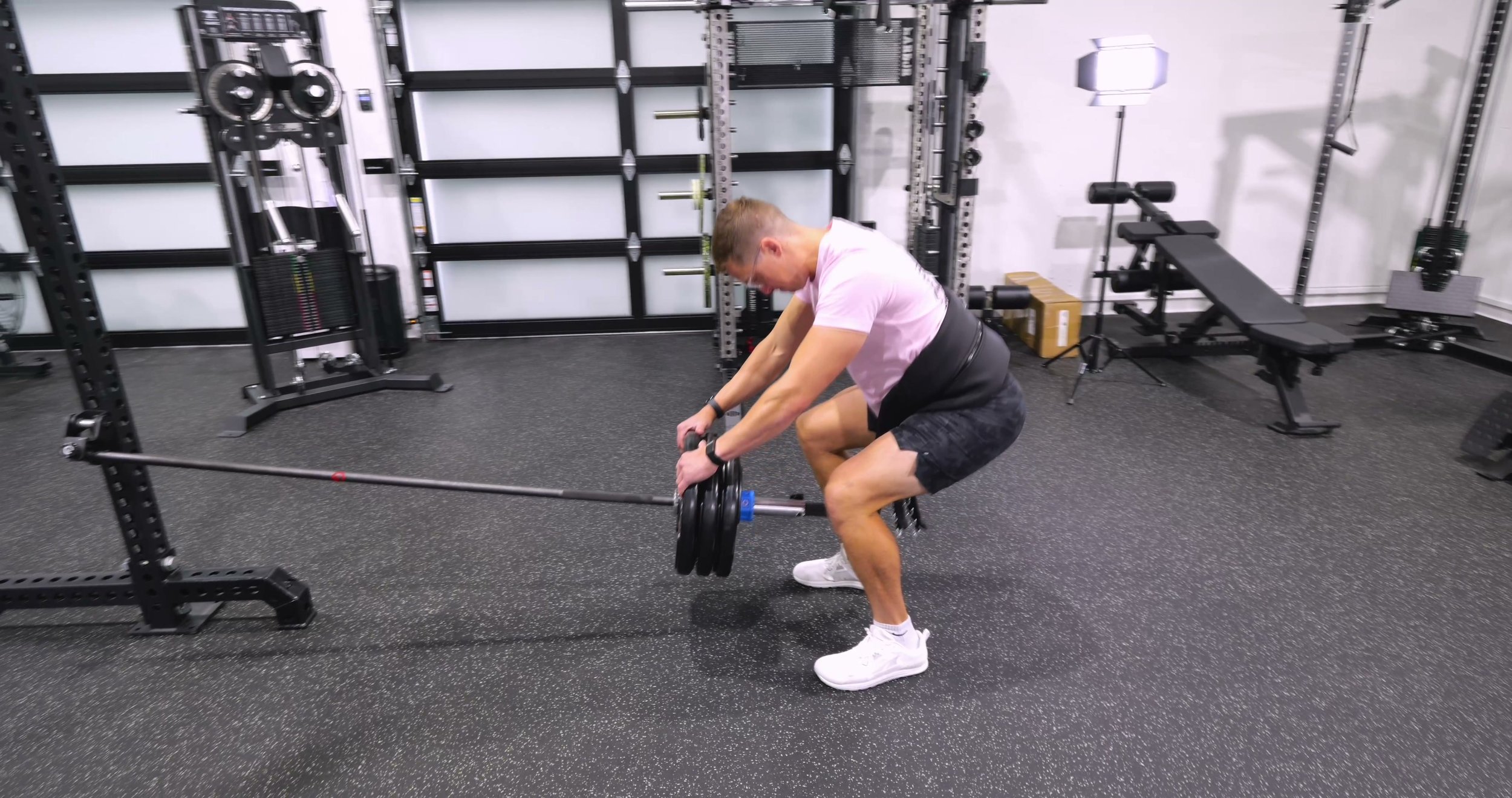 Exponent Edge Landmine Bar configured for a belt-squat-style exercise in a home gym