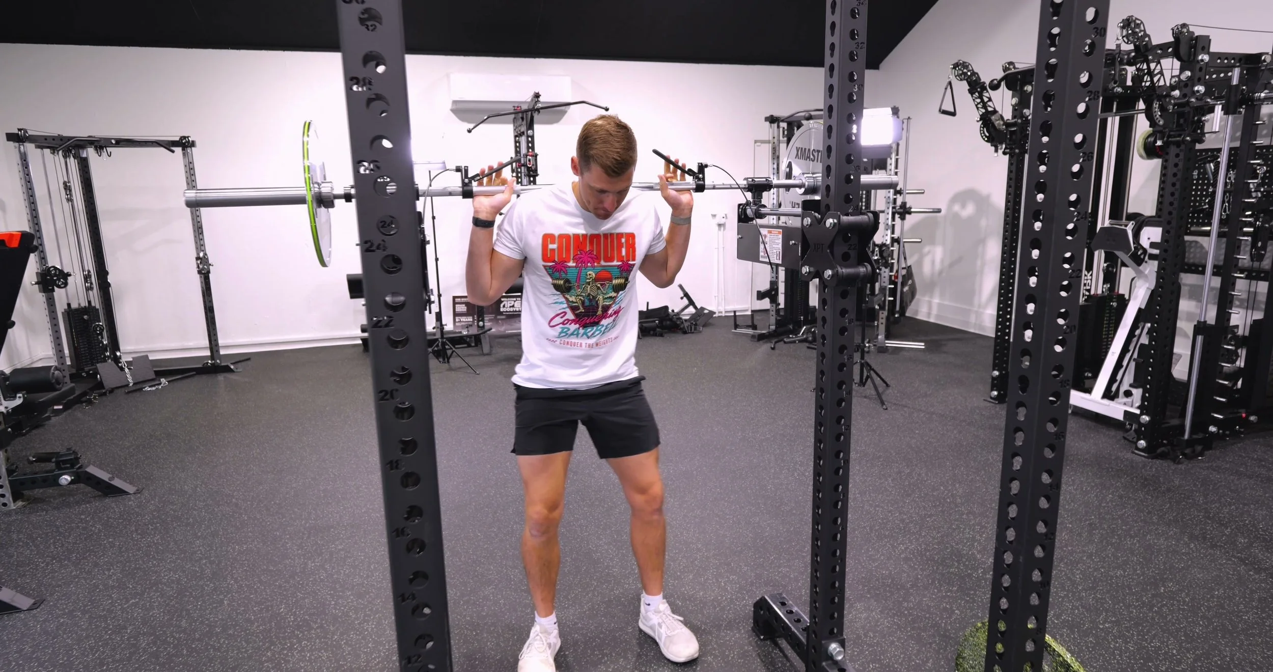 Squatting with the XPT Self-Spotting Bar