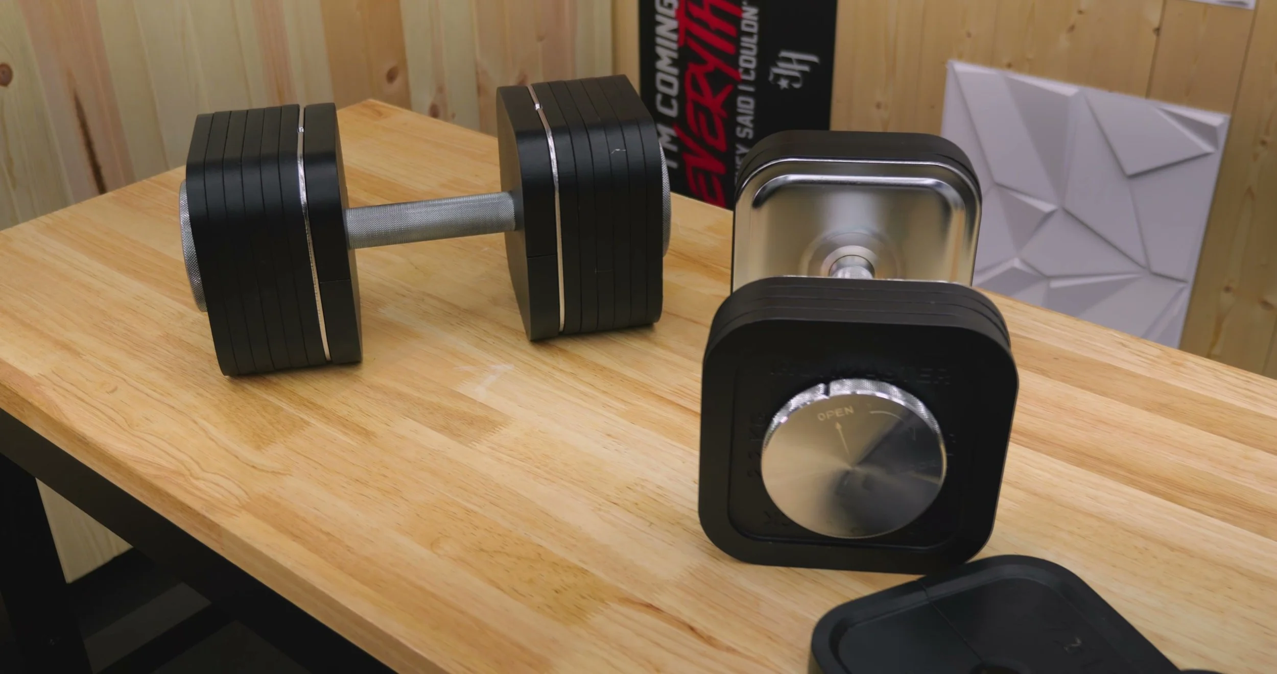 Ironmaster Quick-Lock dumbbells with plates and spin locks on a bench