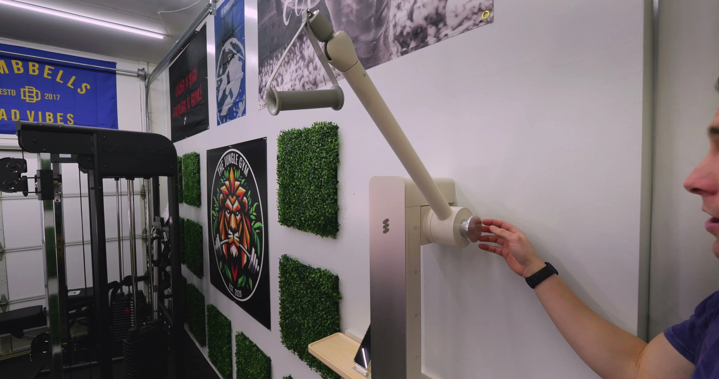 Narrow side profile of AMP Fit device mounted to wall showing minimal footprint