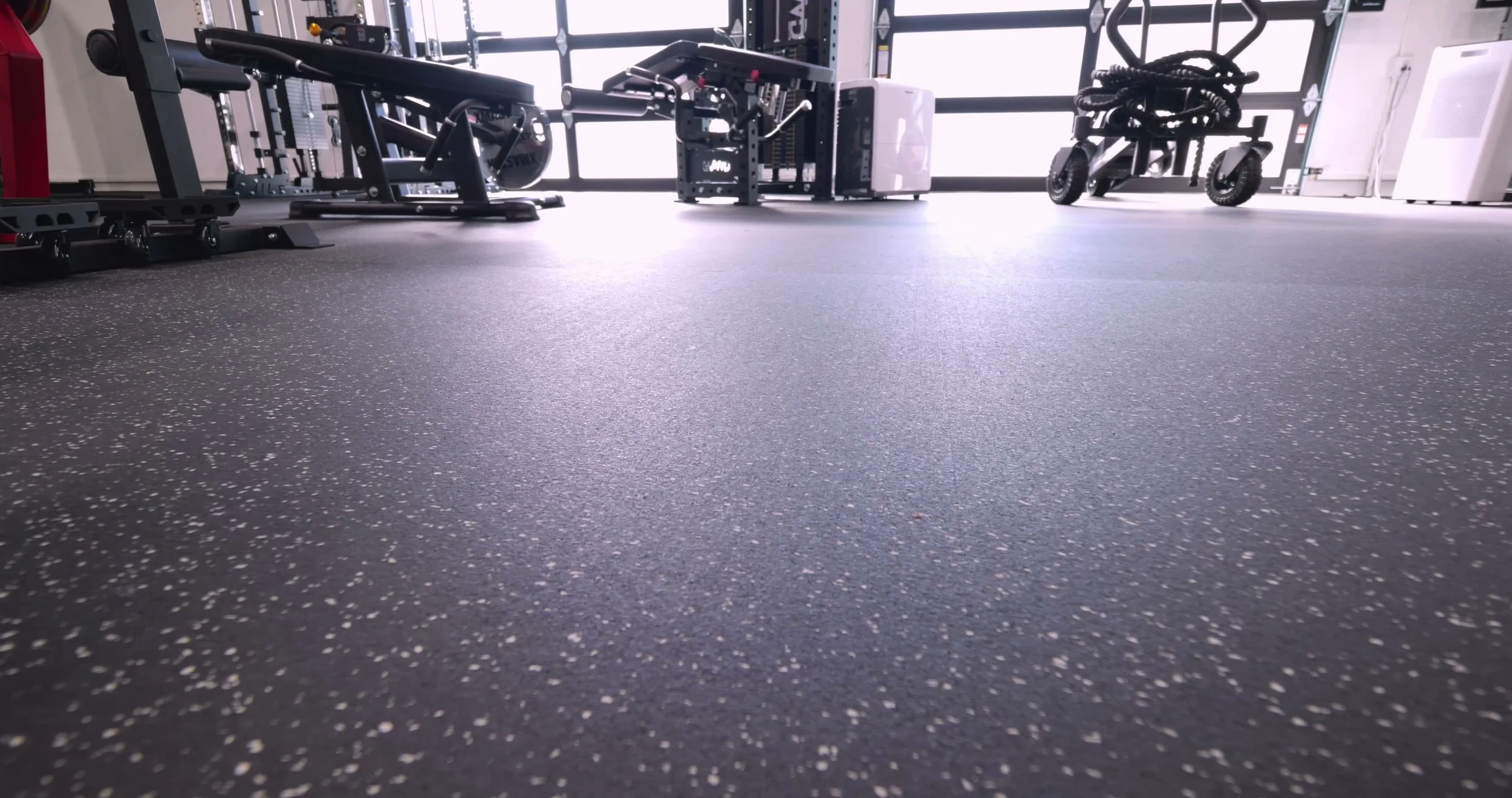 Edge profile showing the 8mm thickness of the HammerClad rolled rubber flooring.