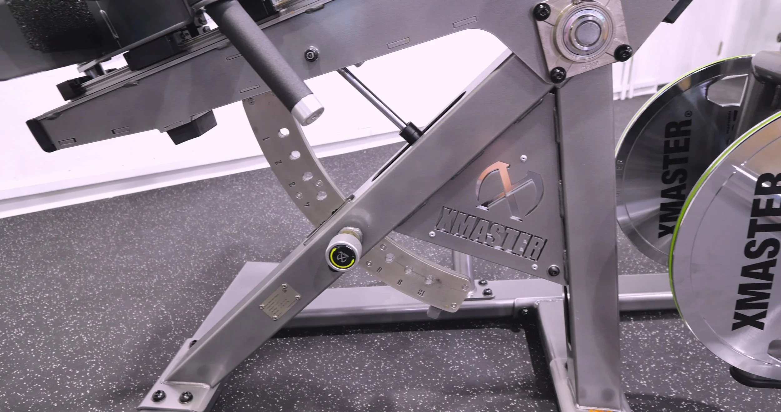 Close-up of the adjustment mechanisms and pop pins on the XMaster Posterior Chain Trainer