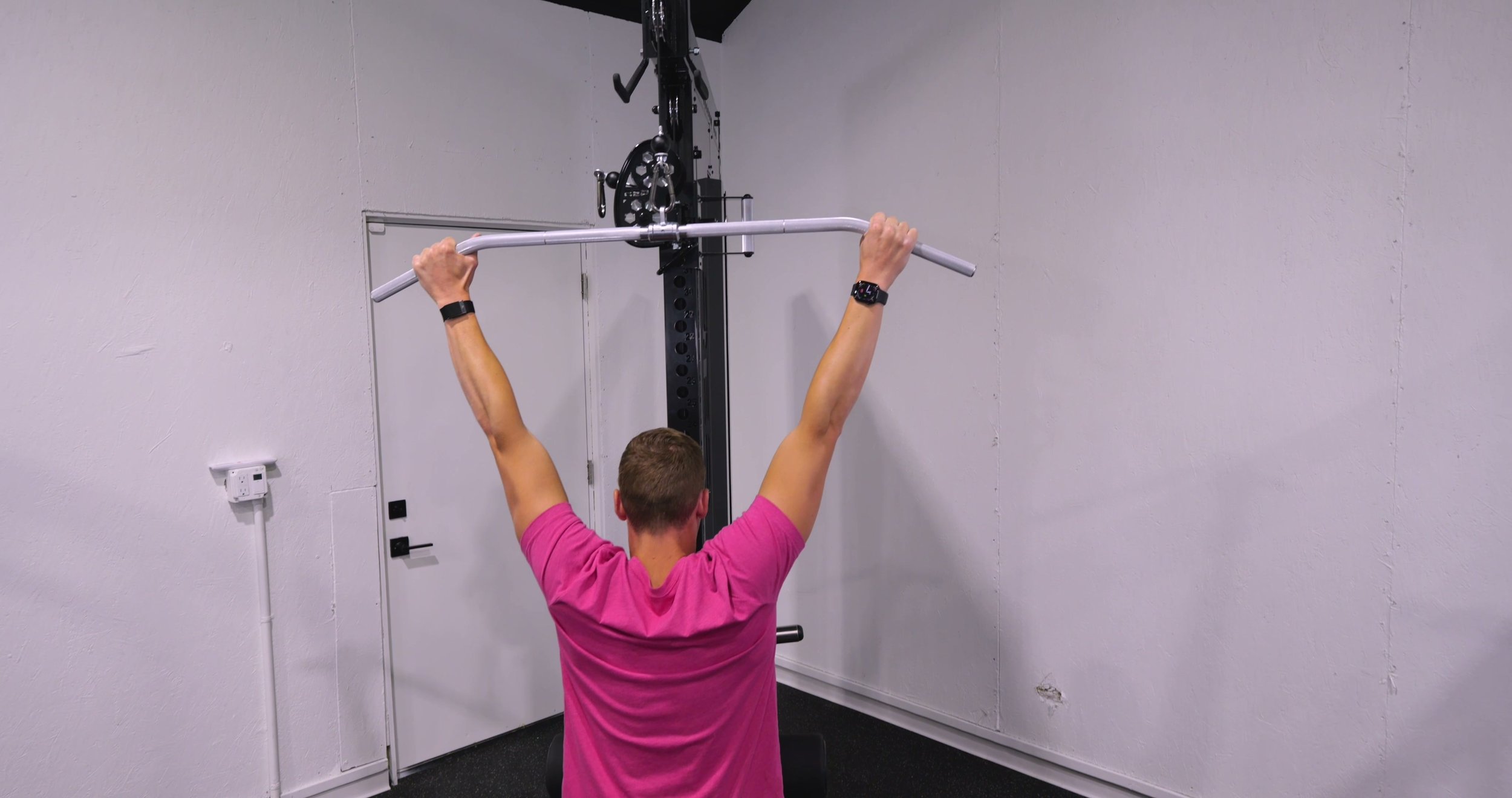 Michael performing a lat pulldown on the REP Adonis
