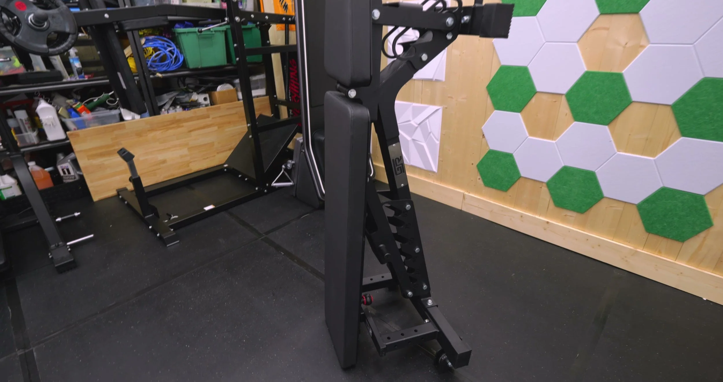 GetRX’d FID AB2 bench stored upright against a wall in a garage gym