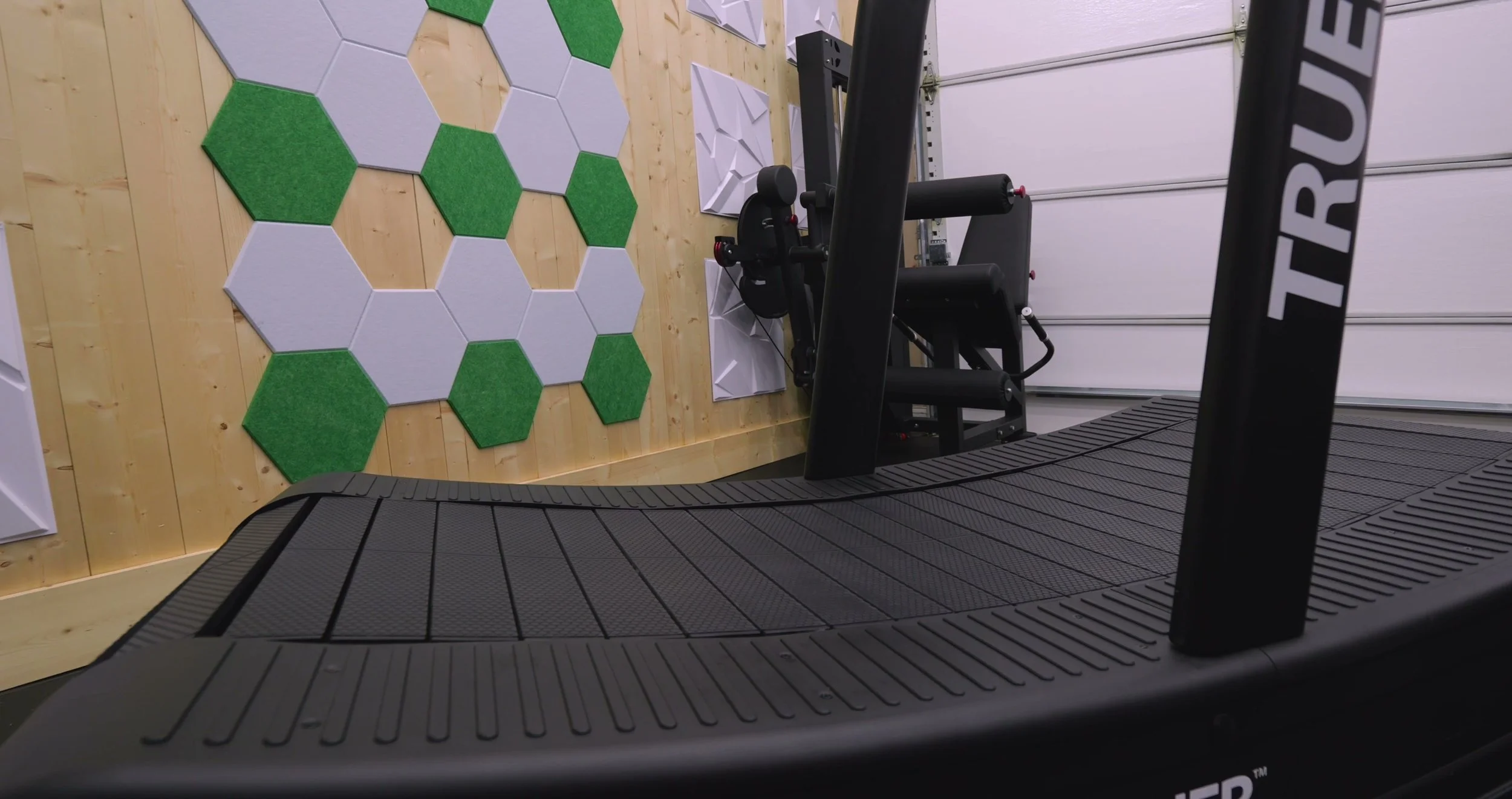 Close-up of cushioned treadmill slats and roller bearings on TrueForm Trainer