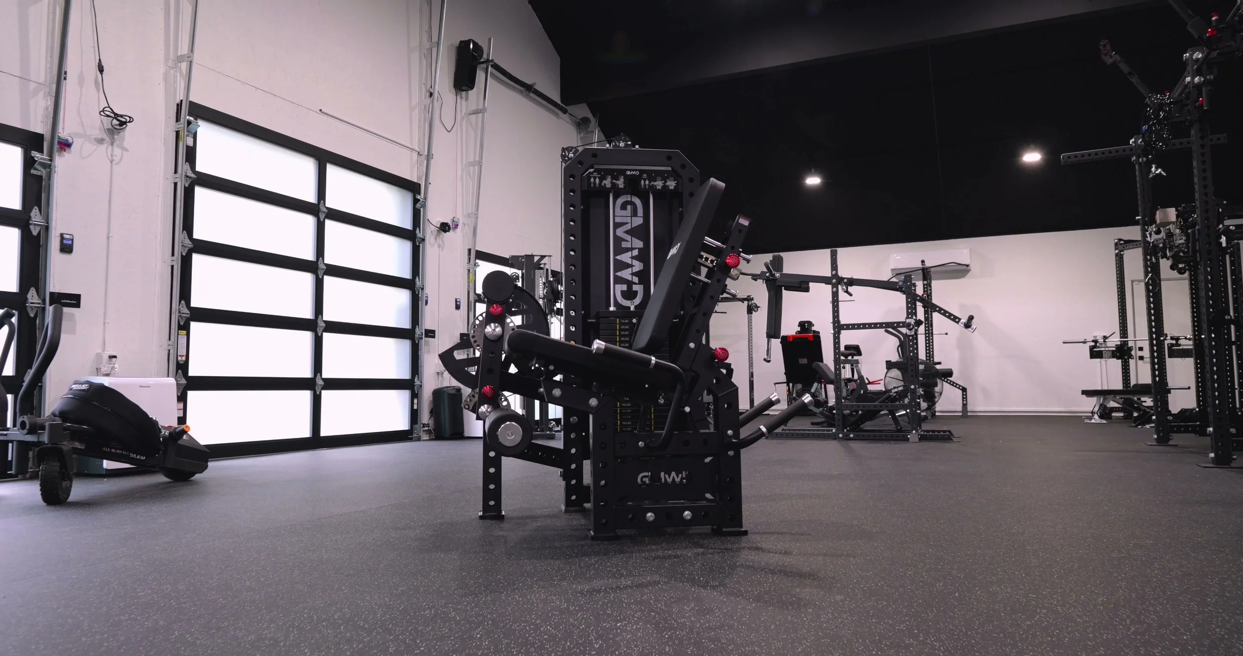The GMWD LE11 selectorized leg extension and prone leg curl machine fully assembled in a home gym
