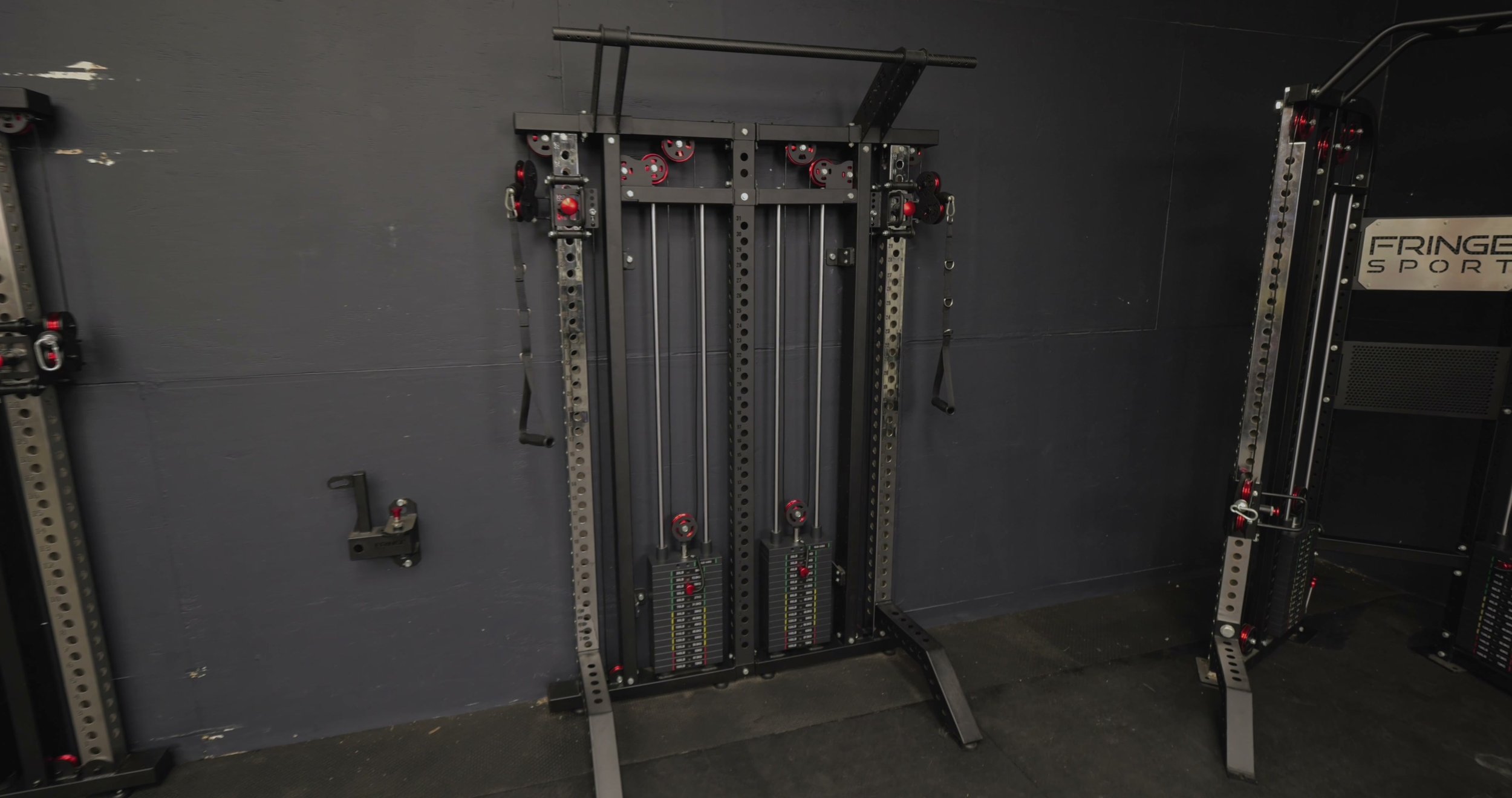 dual slim gym cable columns connected with pull up bar configuration